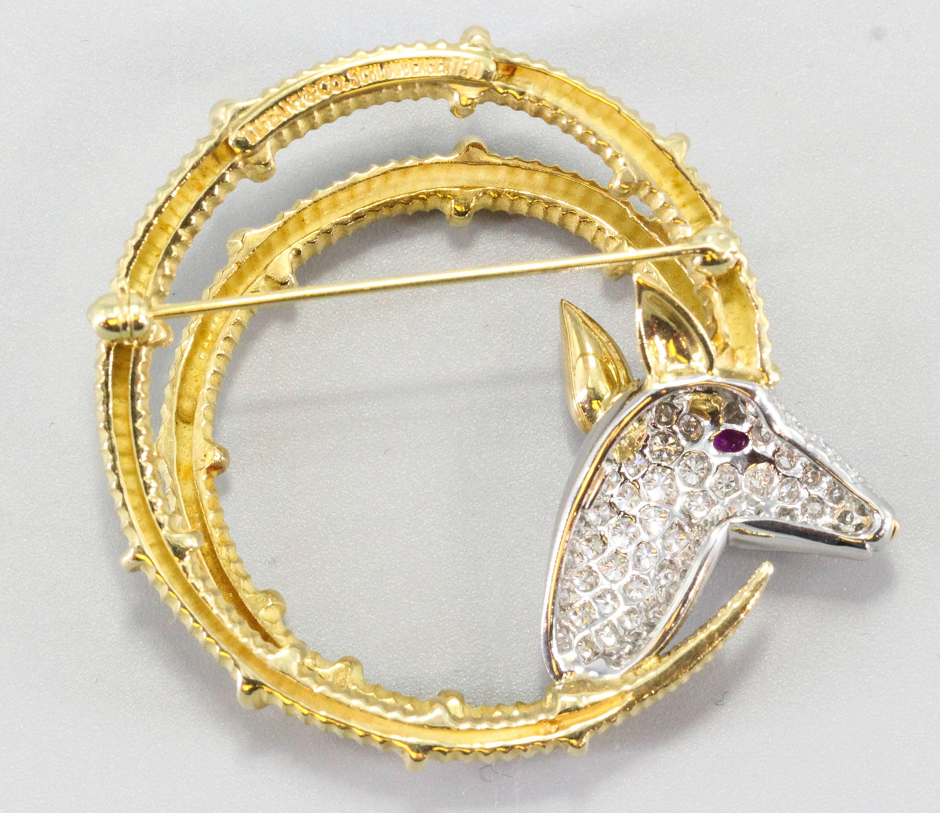 Very fine Ibex brooch by Tiffany & Co. Schlumberger.  Made in 18k yellow gold and platinum, with a ruby eye and high grade white diamond pave. 

Hallmarks: Tiffany & Co., Schumberger, 750, PT950.