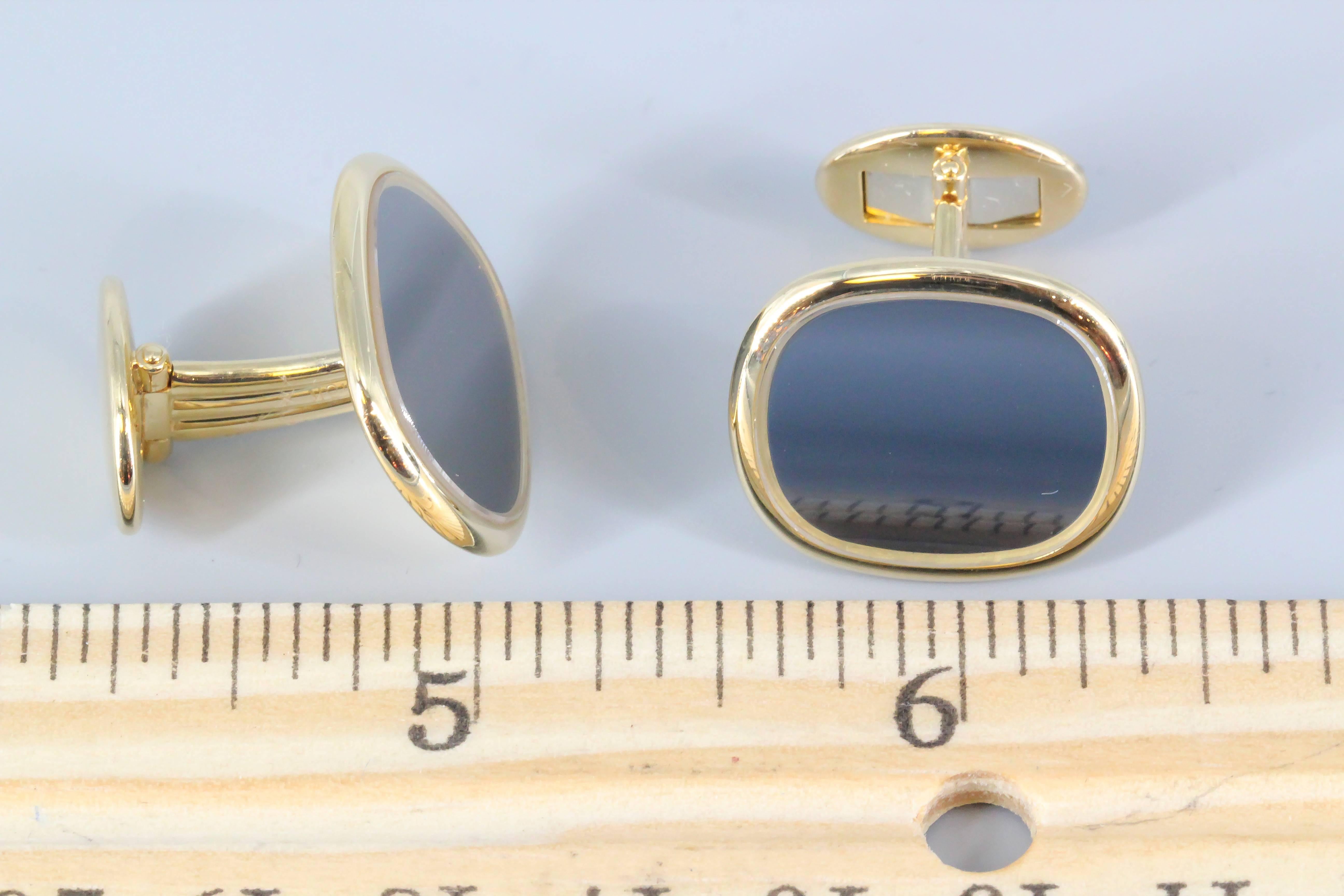 Handsome 18K yellow gold cufflinks from the Ellipse collection by Patek Philippe. These are the largest size available and feature a sharp blue sunburst face. Refined and elegant in their simplicity yet displaying great presence.

Hallmarks: Patek