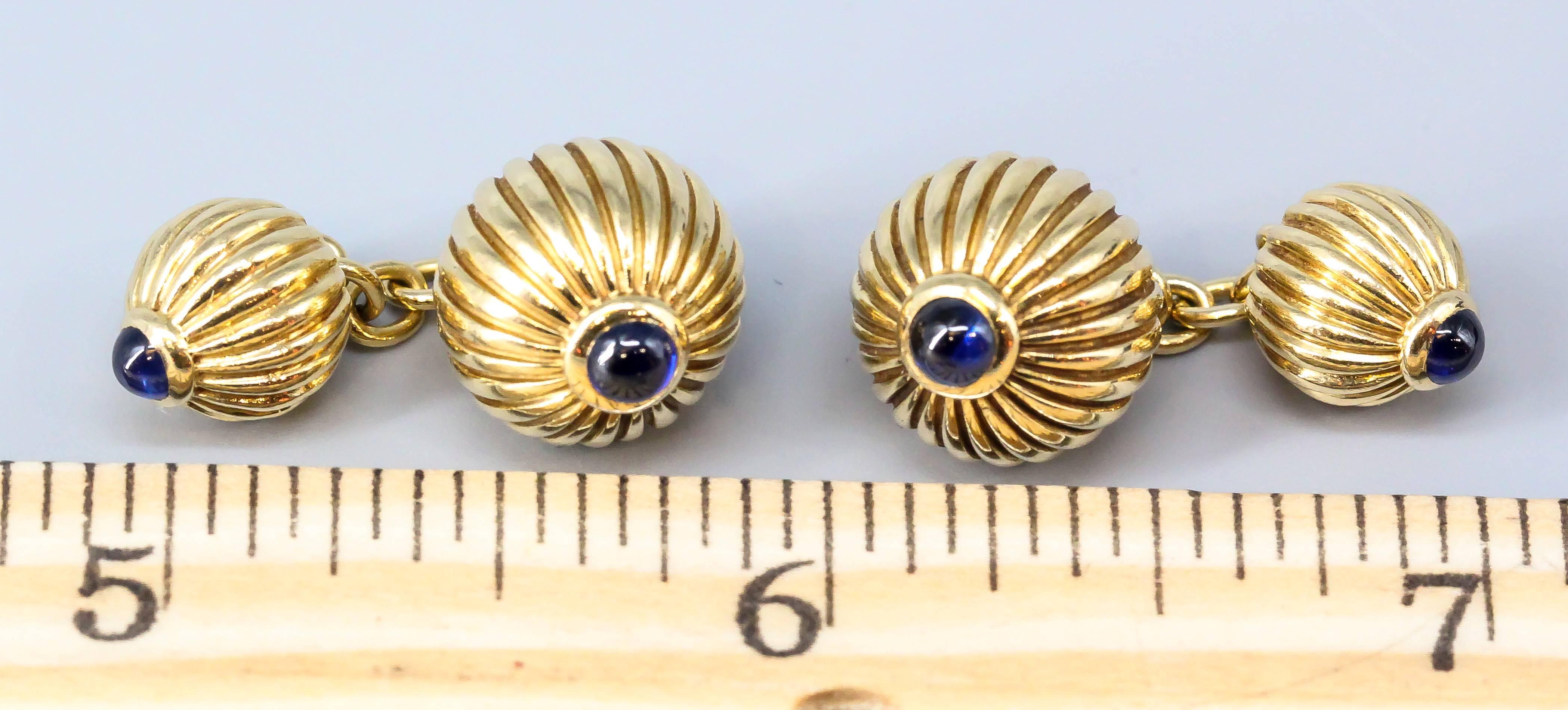 Elegant and rare sapphire and 18K gold ribbed sphere cufflinks by Cartier from the 