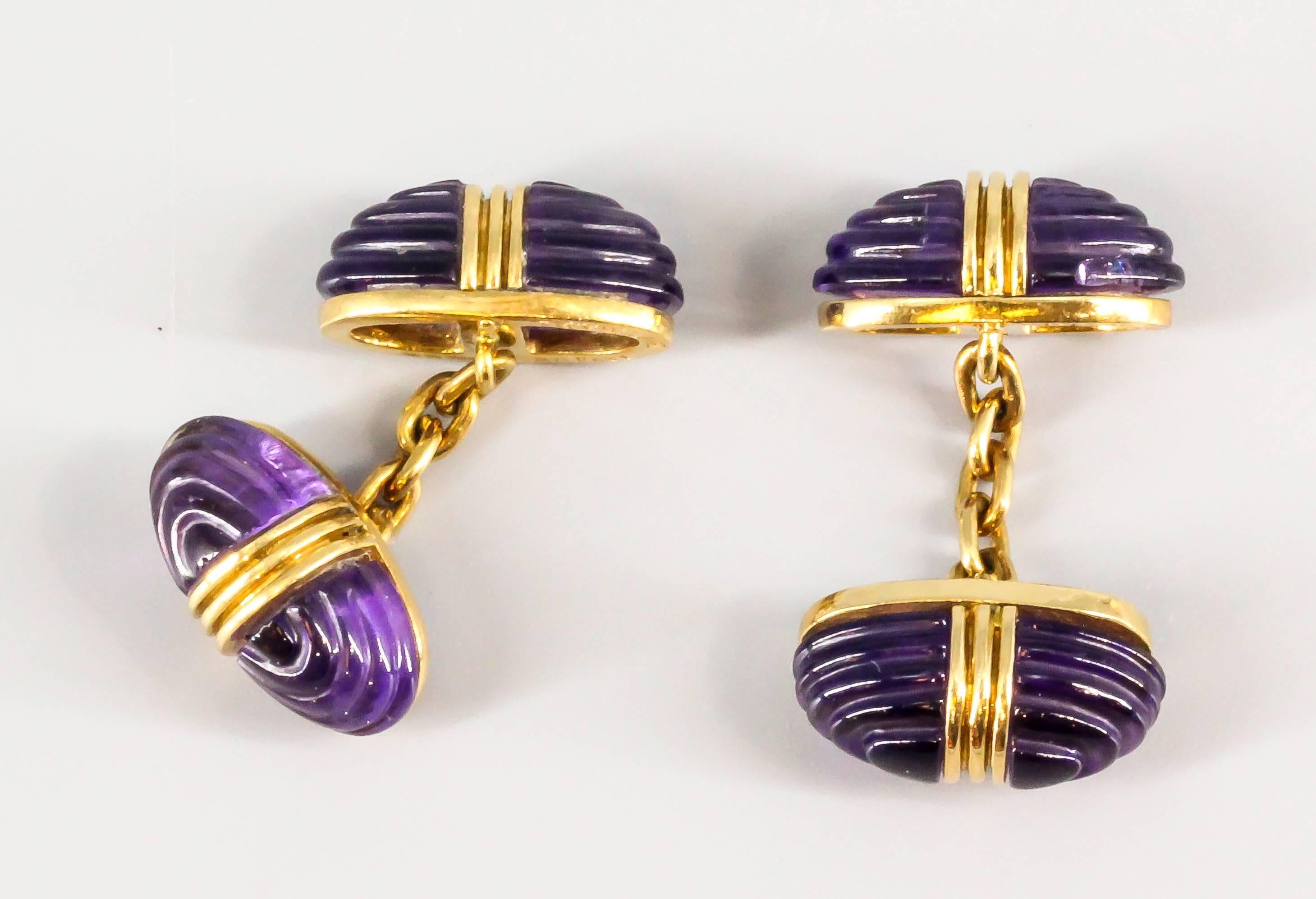 Rare and unusual carved amethyst and 18K yellow gold cufflinks and studs set by Bulgari, circa 1960s. Beautifully made with excellent workmanship. Set comes with three studs.

Hallmarks: Bulgari, 750, Italian standard marks, reference numbers.