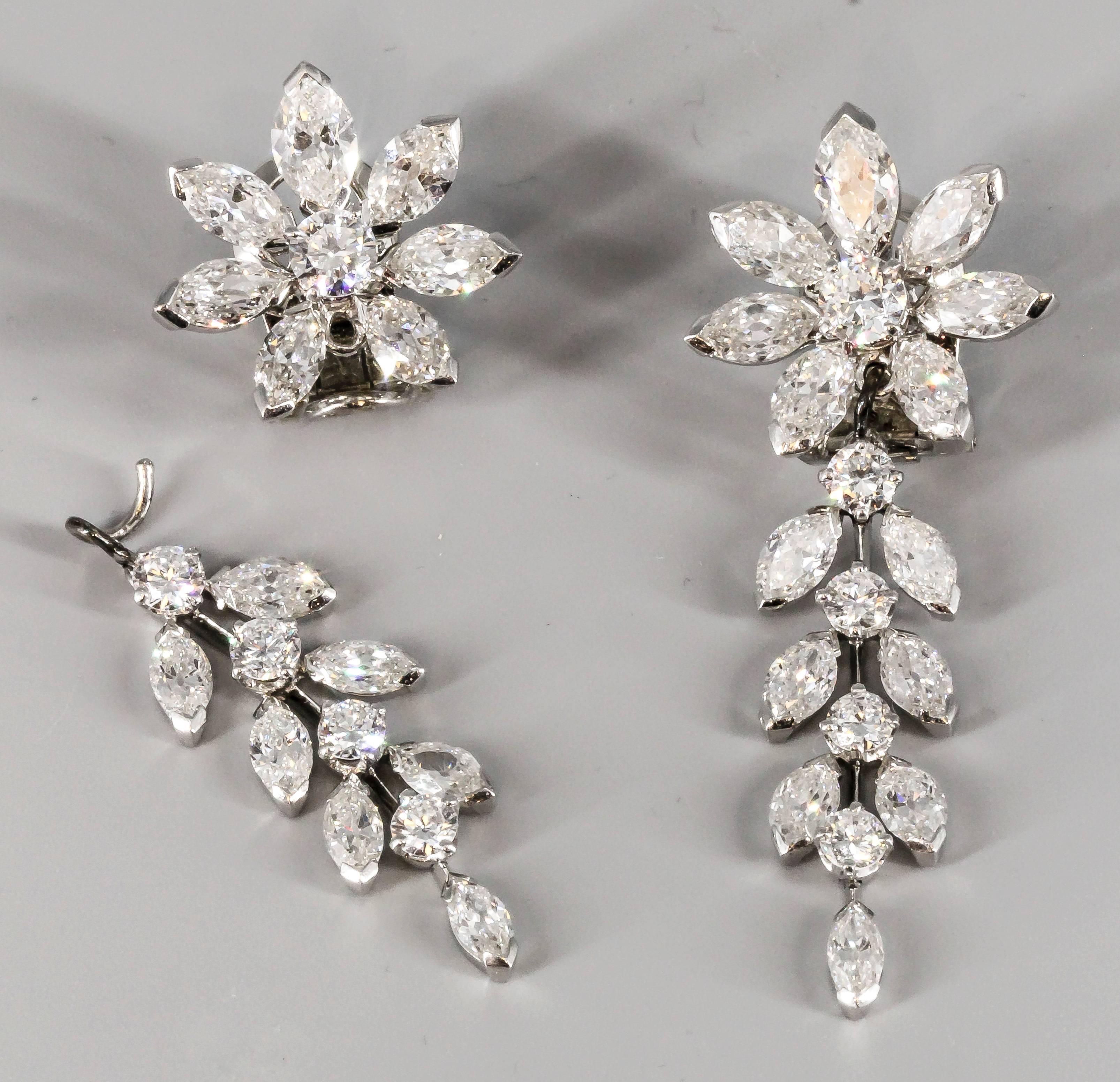 Elegant diamond, platinum and 18K white gold pendant earrings by Van Cleef & Arpels. circa 1960s. They feature high grade round brilliant cut and marquise cut diamonds of approx. 12 carats of total weight. Designed to resemble a flower, the top of