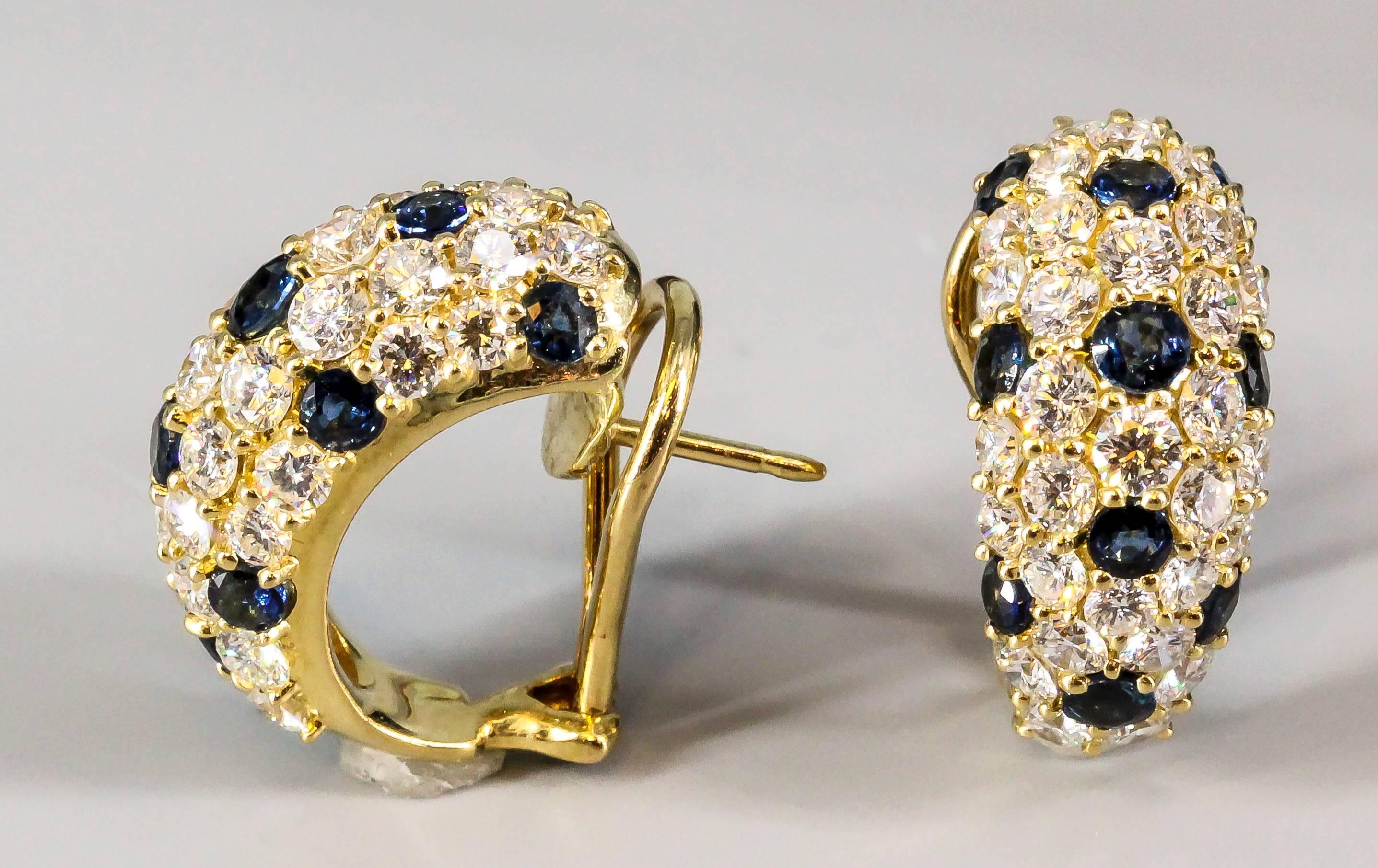 Elegant blue sapphire and diamond huggie-style earrings  by Tiffany & Co. They feature rich blue round cut sapphires of approx. 1.5 carats, and high grade round brilliant cut diamonds of approx 4.0 carats. Great workmanship and very easy to