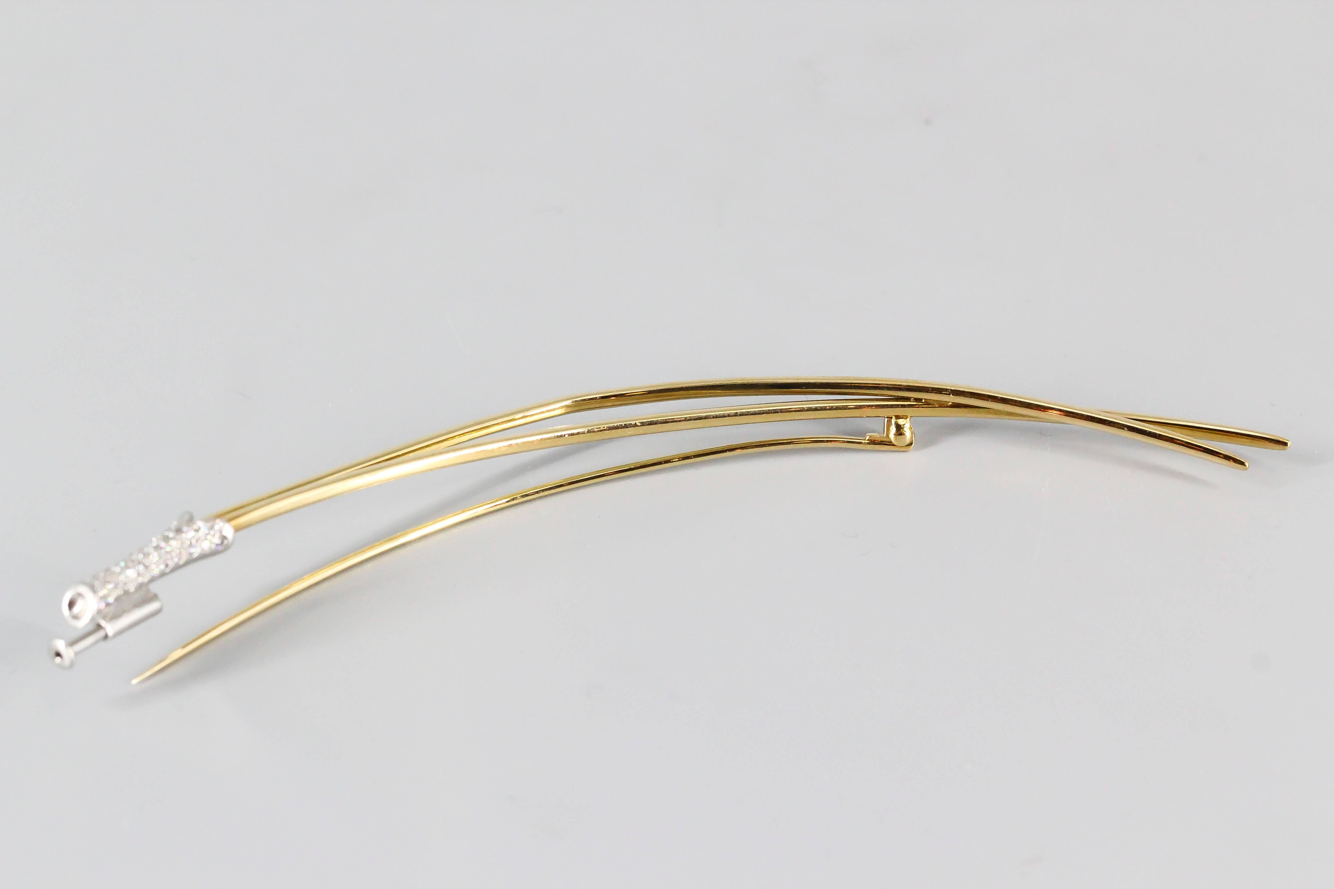 Very rare and interesting diamond, platinum and 18K yellow gold brooch by Tiffany & Co. Elsa Peretti. It resembles blades of grass, with high grade round brilliant cut diamonds on the base of one of them, approx. .5-1.0 carats. Superb workmanship