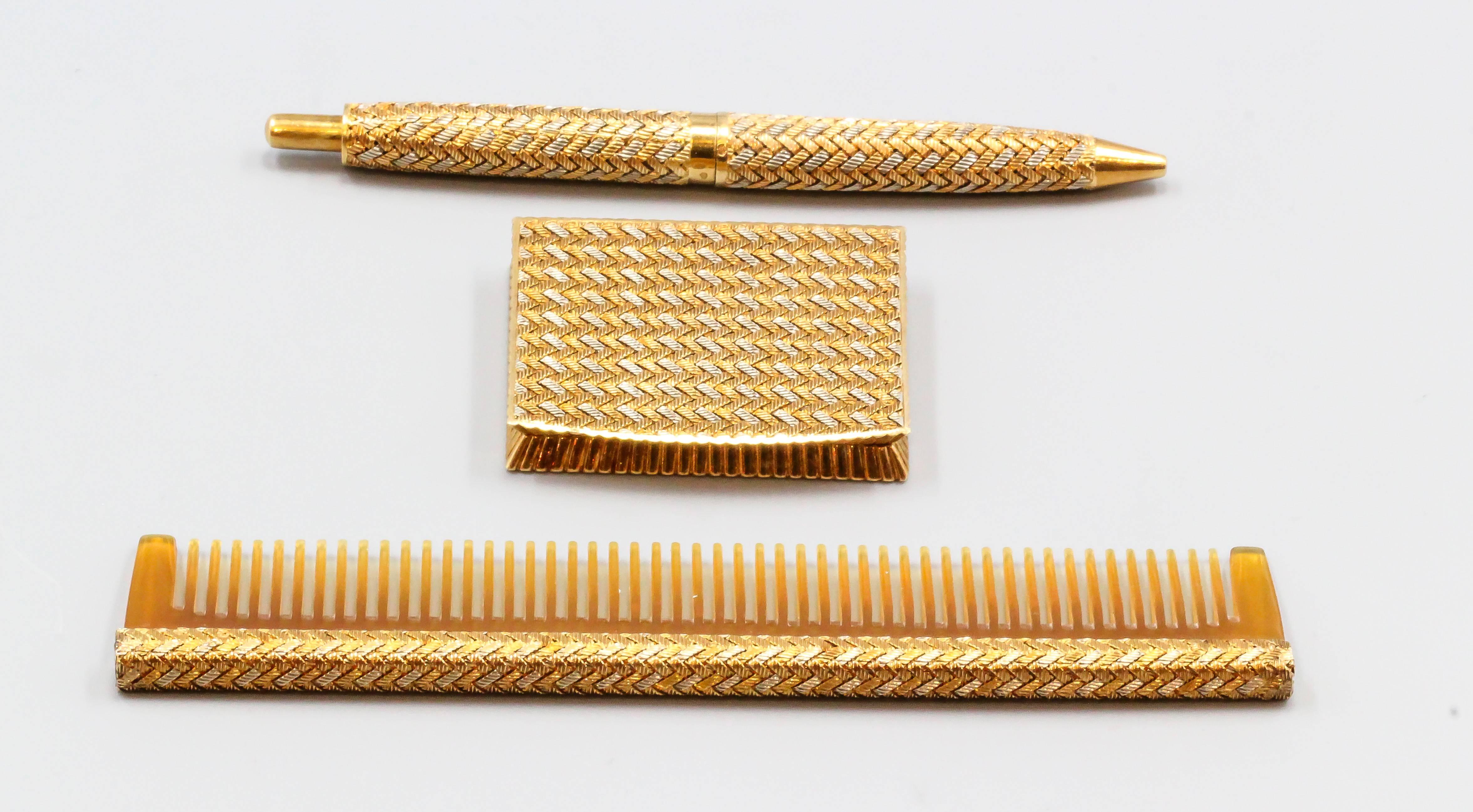 Stylish 18K white, yellow and rose gold basket weave vanity set of French origin, circa 1940s-50s. It features beautiful and intricate workmanship and includes a pill box, ballpoint pen and comb. Highly ornate and collectible and would make a great