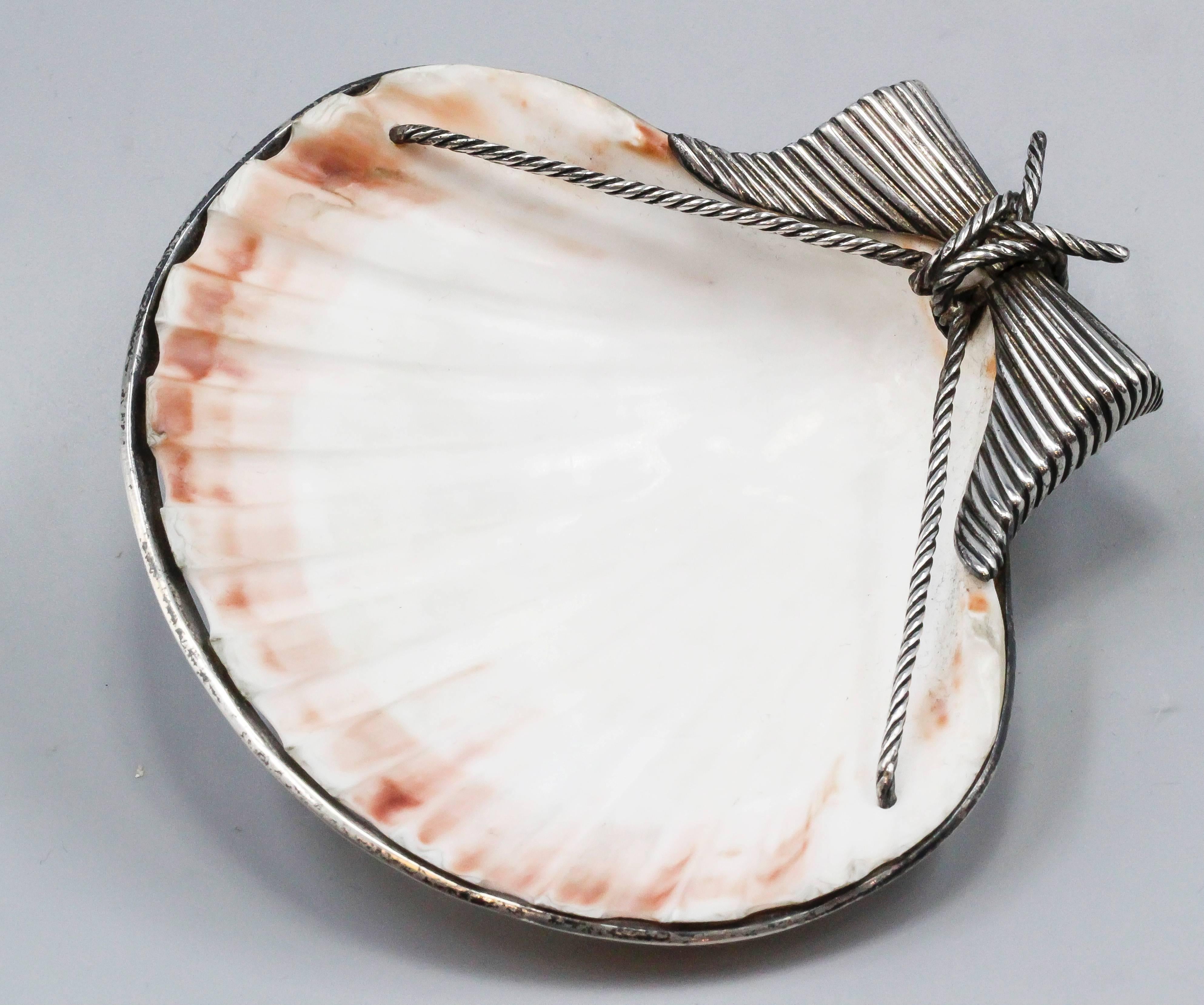 Rare and unusual sterling silver seashell dish by Tiffany & Co. Schlumberger, circa 1970s. It can be used for a variety of things, key holder, ashtray, candy holder, you name it. Great workmanship and highly versatile.

Hallmarks: Tiffany & Co.,