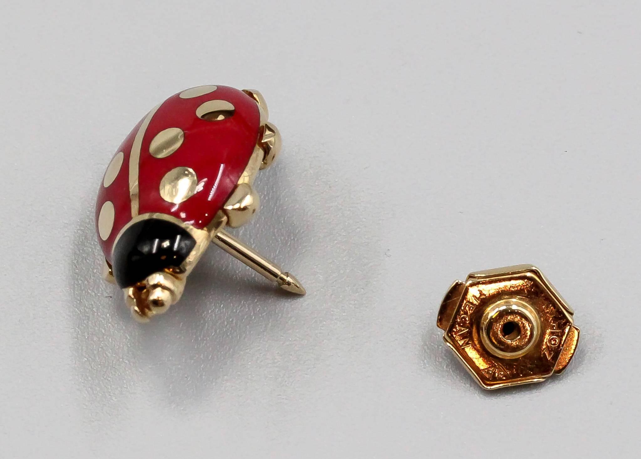 Whimsical red and black enamel and 18K gold pin by Cartier. It resembles a ladybug, with black enamel head, red enamel body and gold accents. Beautifully made and highly wearable for any occasion.

Hallmarks: Cartier, 1990, reference numbers, 750,