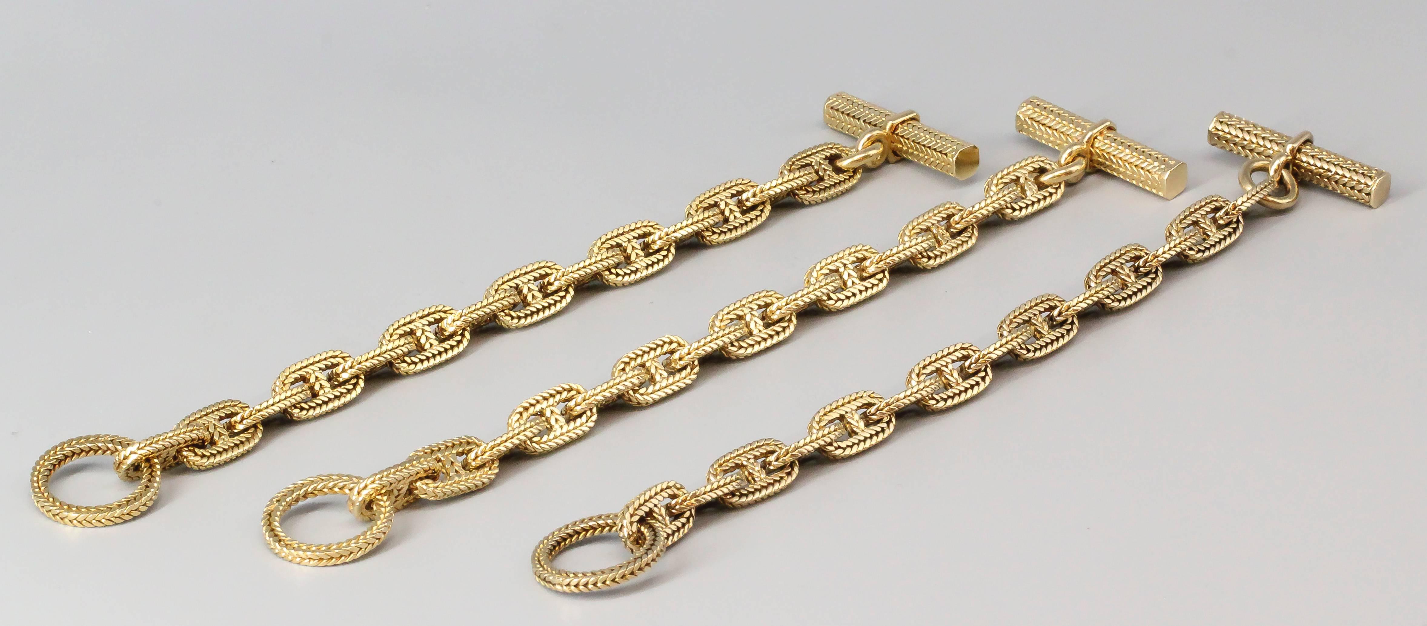 Stylish and elegant set of 3 18K yellow gold toggle link bracelets from the 