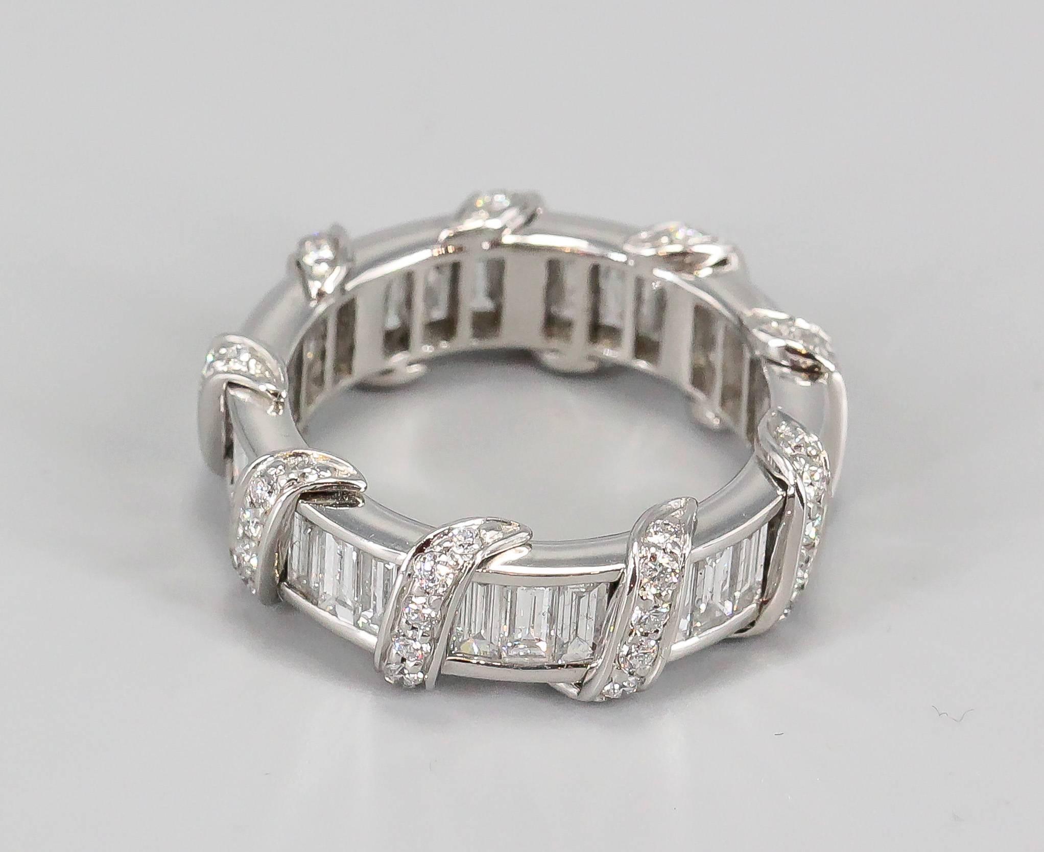 Timeless and chic diamond and platinum band by Verdura. It features high grade round and baguette cut diamonds throughout. Highly ornate and beautifully made. Perfect for day or evening. Approx. retail price $29500.
Approx. size 6.5.

Hallmarks:
