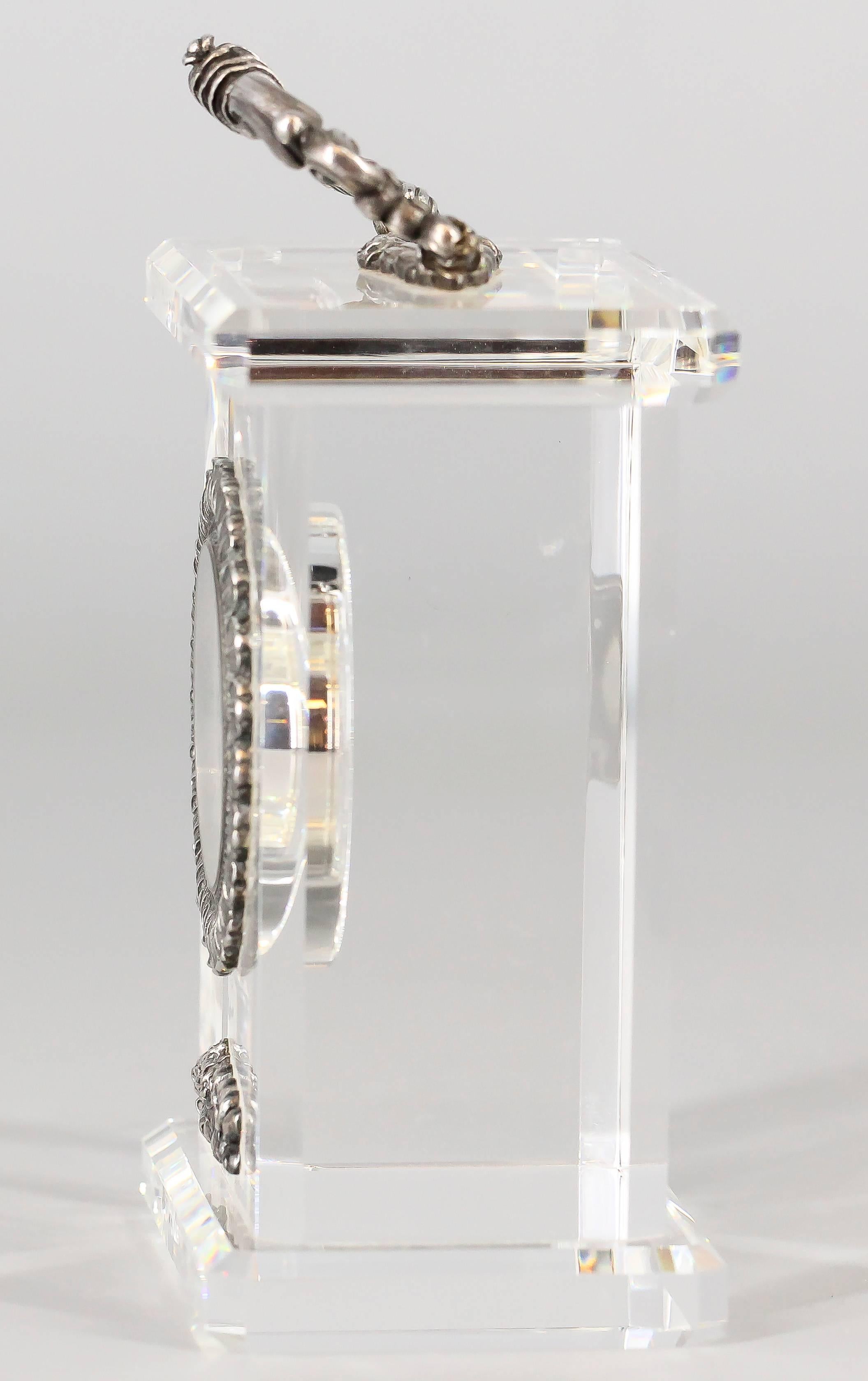 Gorgeous sterling silver and rock crystal limited edition desk clock by Buccellati. It features a beautiful design comprised of clear rock crystal with sterling silver handle bar and accents, as well as the bezel on the clock.  The clock features a