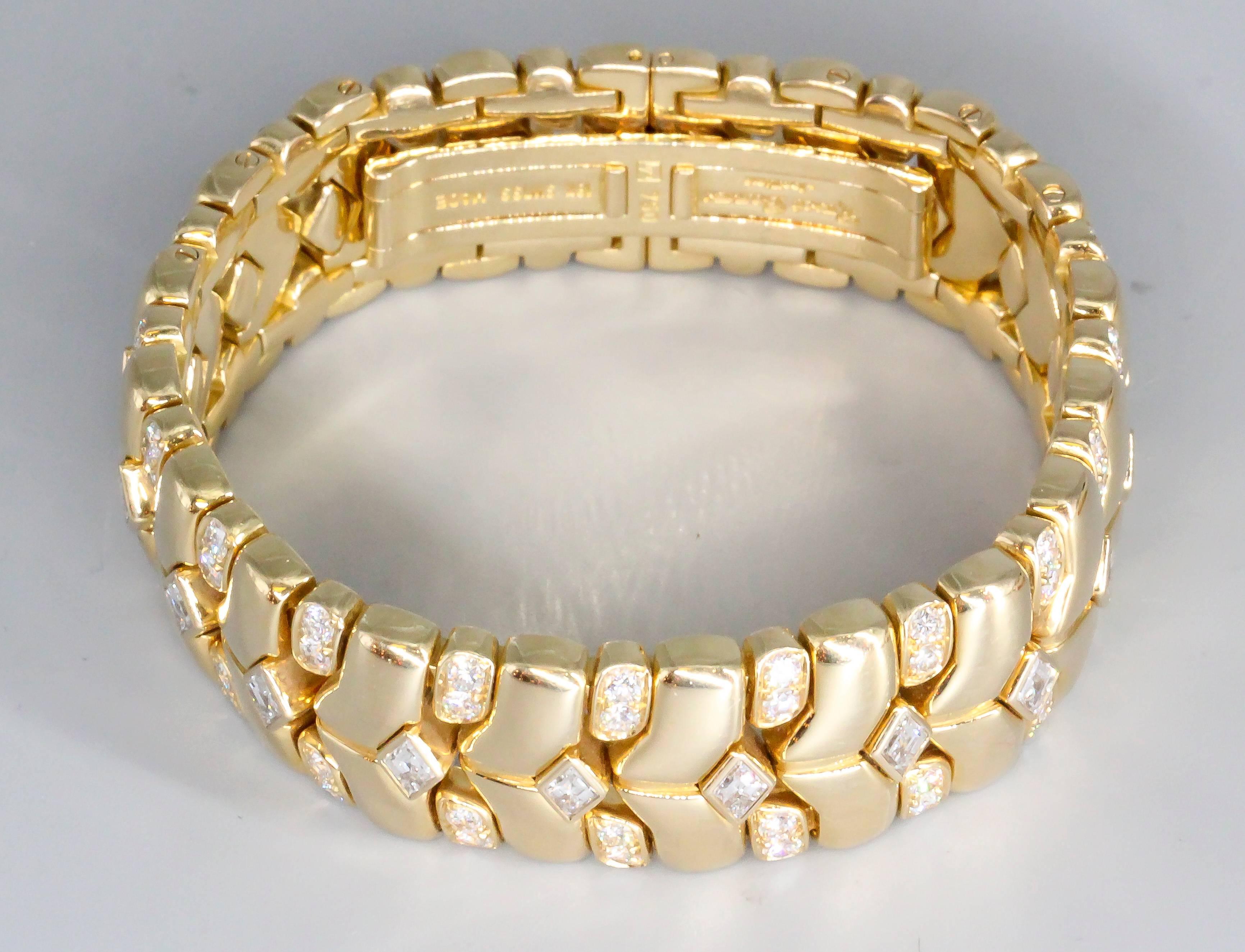 Elegant diamond and 18K yellow gold bracelet by Rene Boivin. It features high grade brilliant round and diamond shape cut diamonds, total weight of approx. 7.0-8.0cts. 18K yellow gold setting, with a dual sided deployment clasp. Beautifully made and