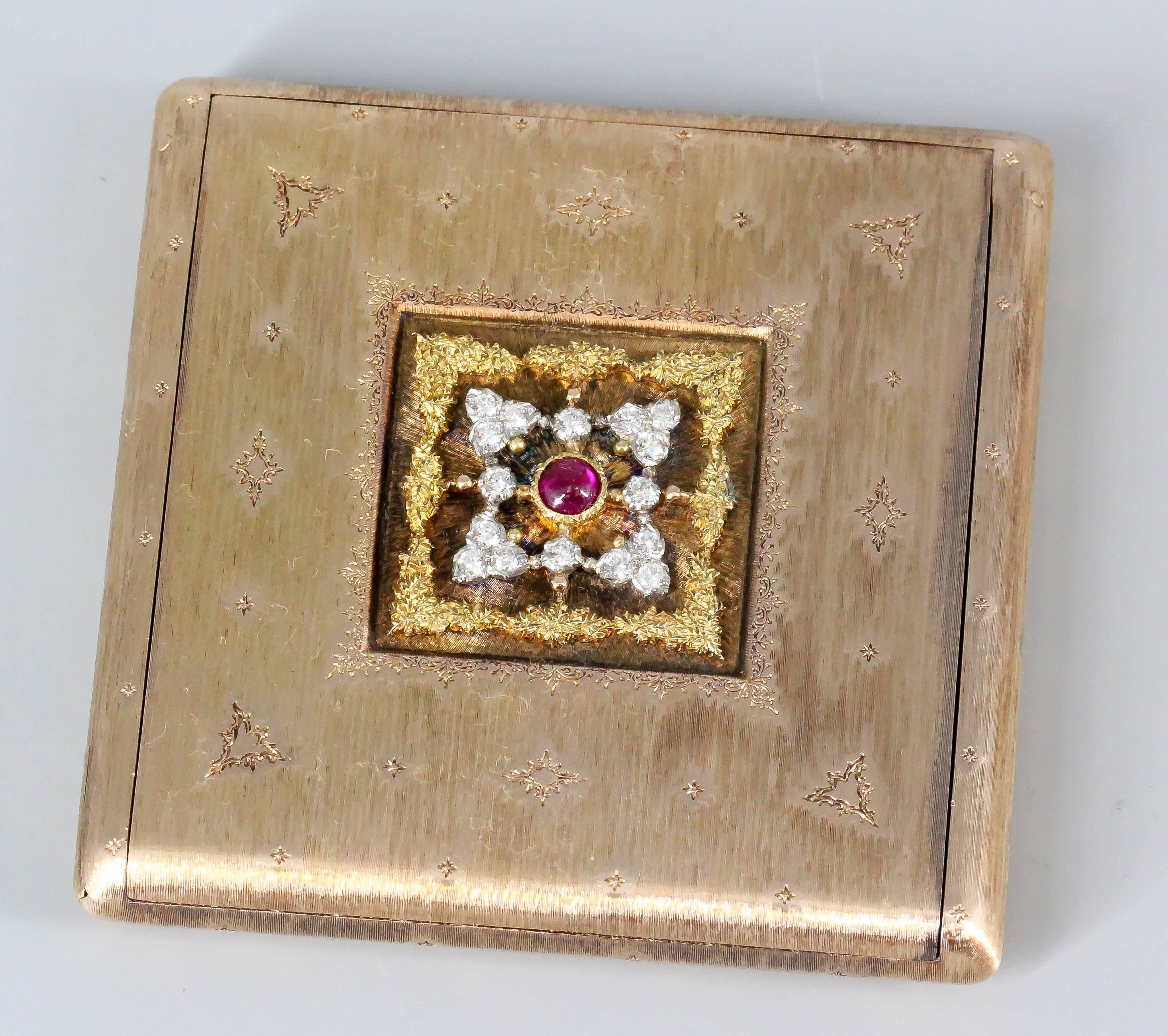 Rare and unusual sapphire, diamond, and 18K rose gold compact by Buccellati, circa 1930s. It features a deep red cabochon ruby in the middle, with high grade round brilliant cut diamonds around it. The case itself is made with 18K rose gold in