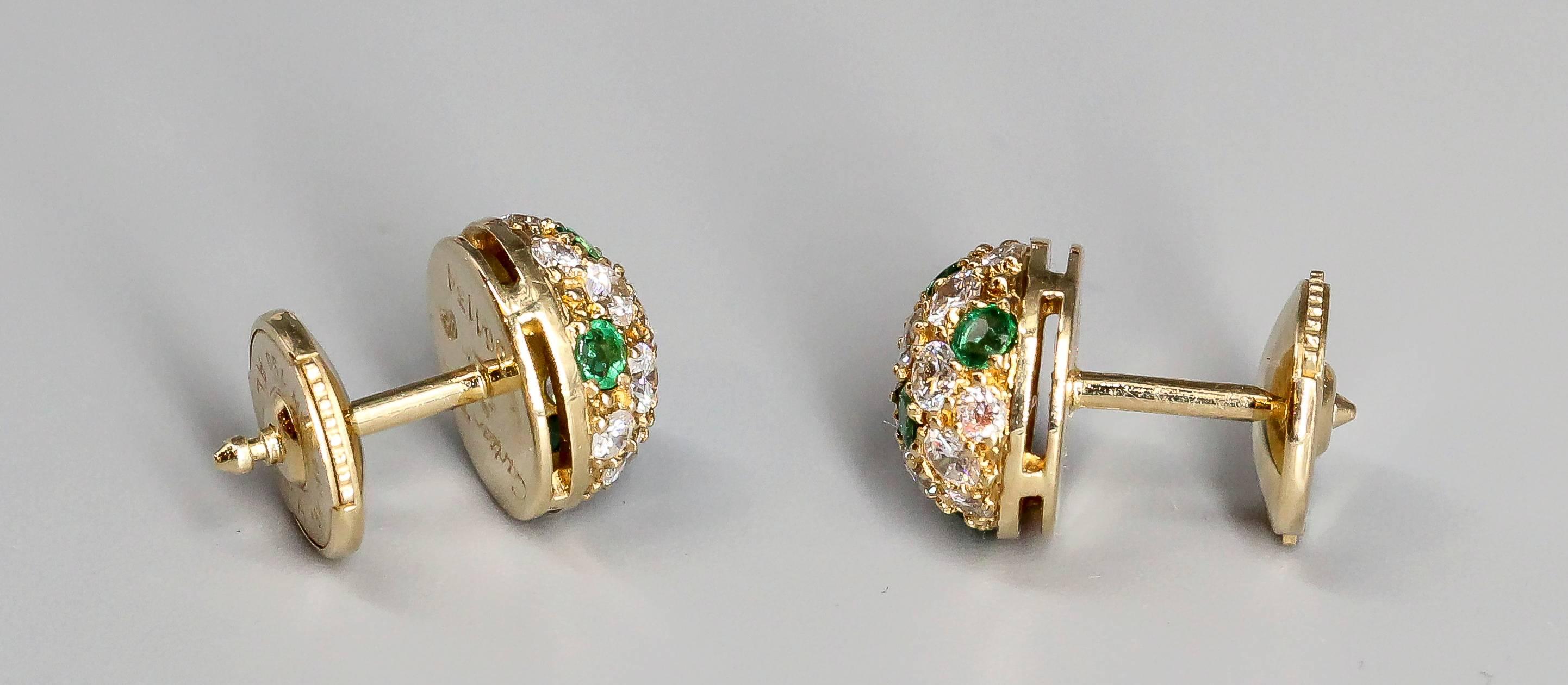 Chic emerald, diamond and 18K yellow gold earrings by Cartier. They feature deep green emeralds, along with high grade round brilliant cut diamonds, over an 18K yellow gold setting. Beautifully made and highly versatile.

Hallmarks: Cartier, 750,