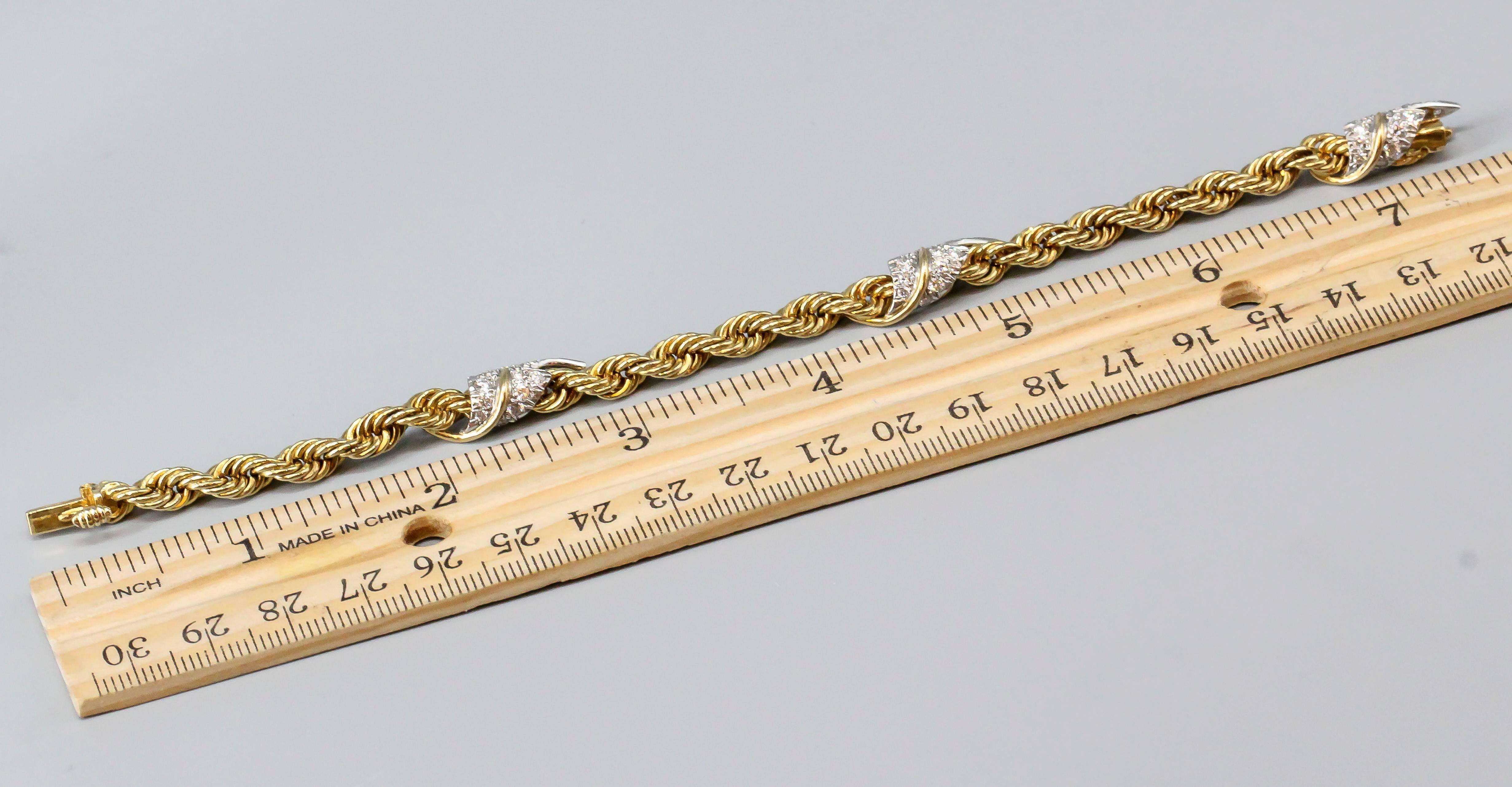 Elegant diamond and 18K yellow gold bracelet by Tiffany & Co. Schlumberger. It features high grade round brilliant cut diamonds set on platinum leaves wrapped around a twisted rope style link. Exceptionally made and easily wearable. 

Hallmarks: