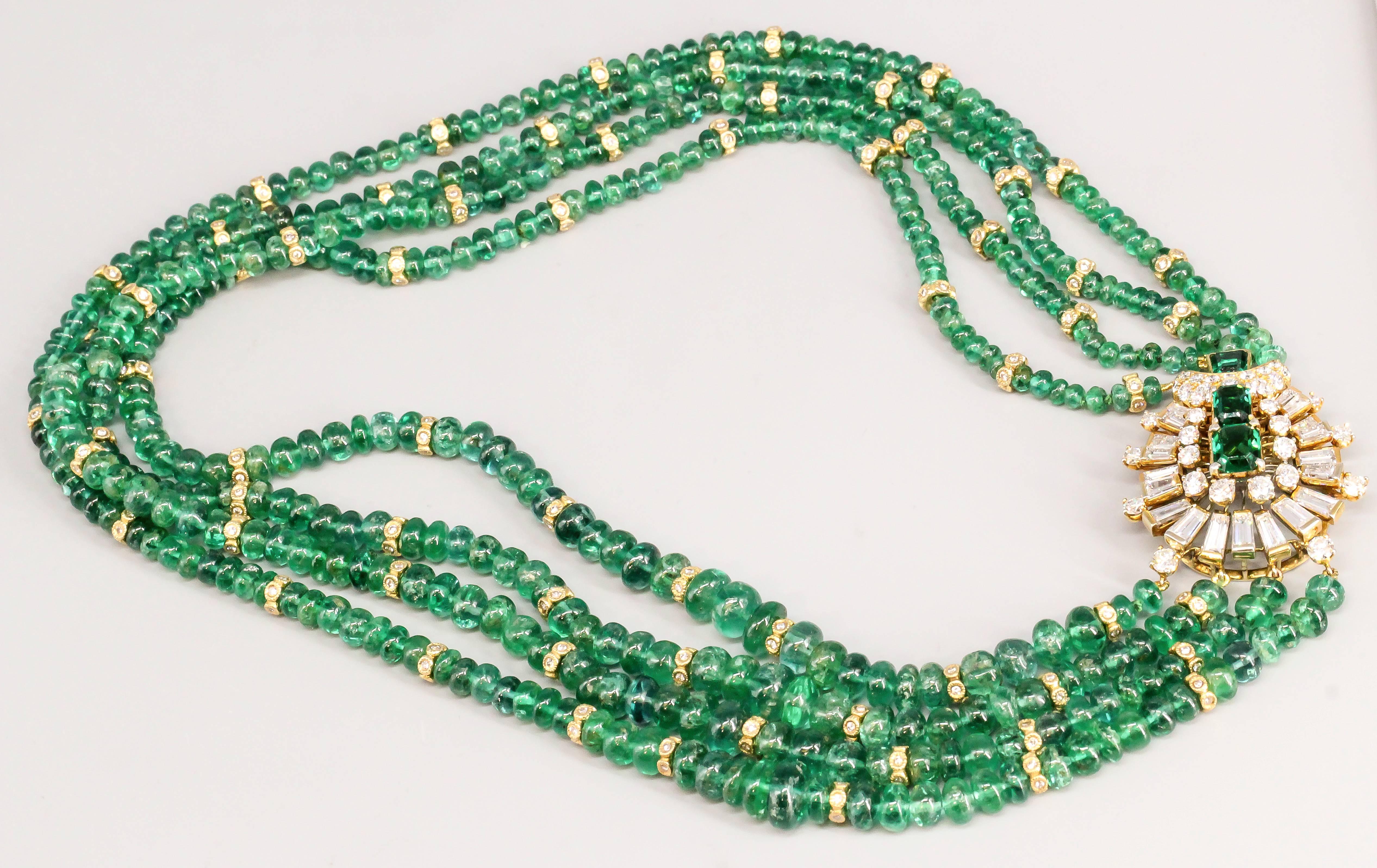 Impressive emerald, diamond and 18K yellow gold beaded necklace. It features high grade round and tapered baguette cut diamonds, approx. 7.0-8.0 cts total weight. Emeralds are deep green and prominently featured with large stones. The rest of the