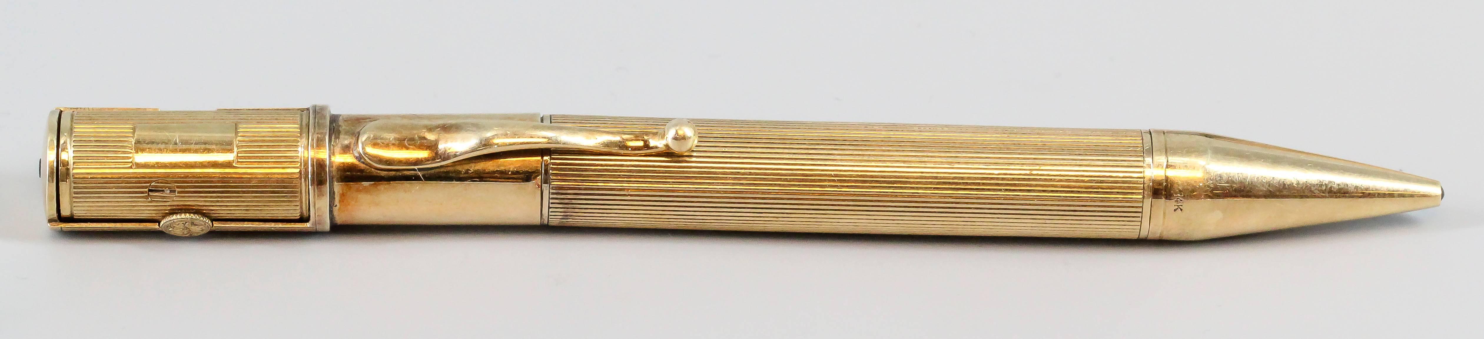 Extremely rare and unusual 14K yellow gold pencil with built-in watch, circa 1940s. Watch has a manual wind movement and simple Arabic numerals; dial signed Cartier and E. Mathey-Tissot & Co.; the watch portion also features a concealing mechanism