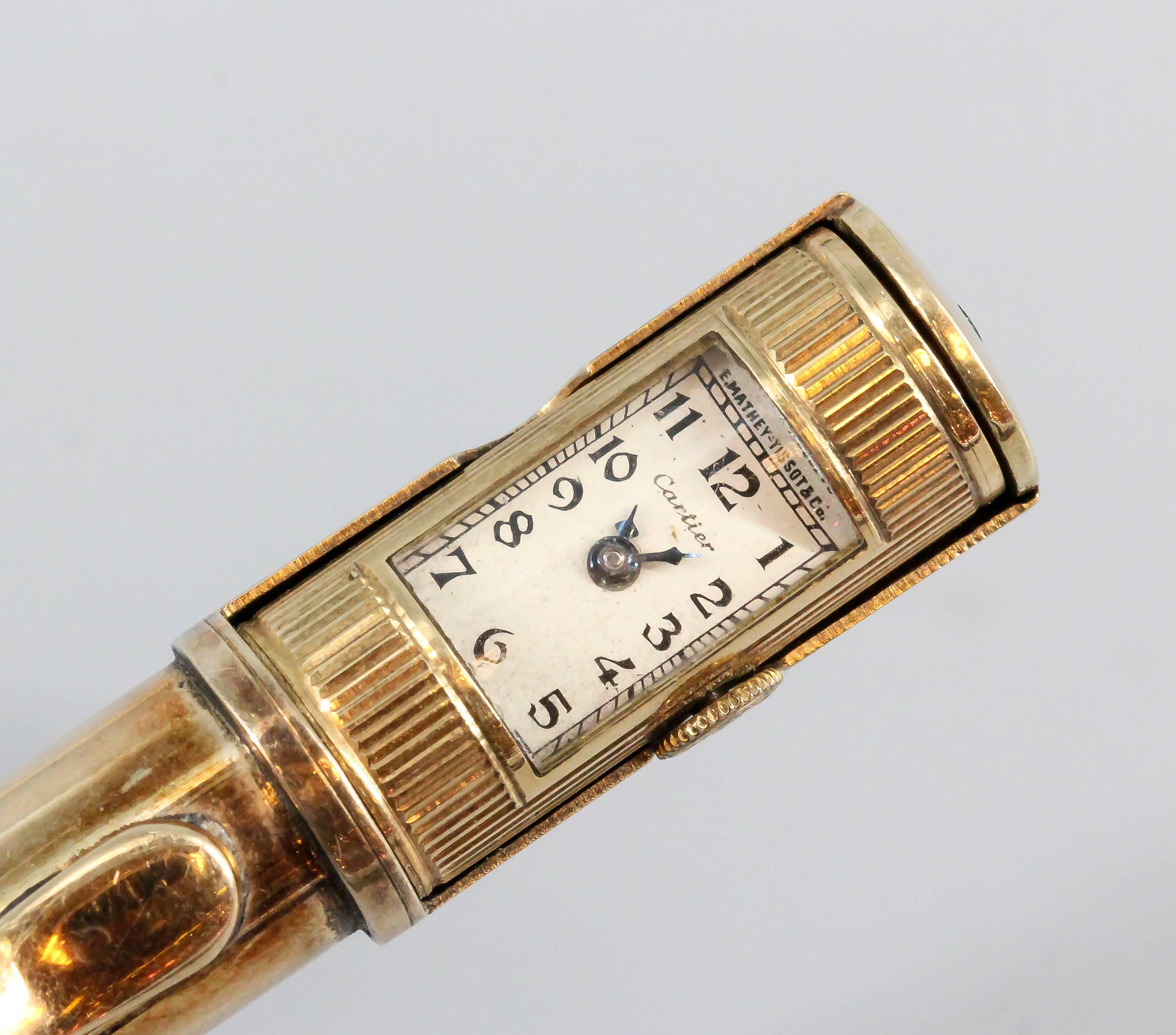 gold cartier lighter with watch