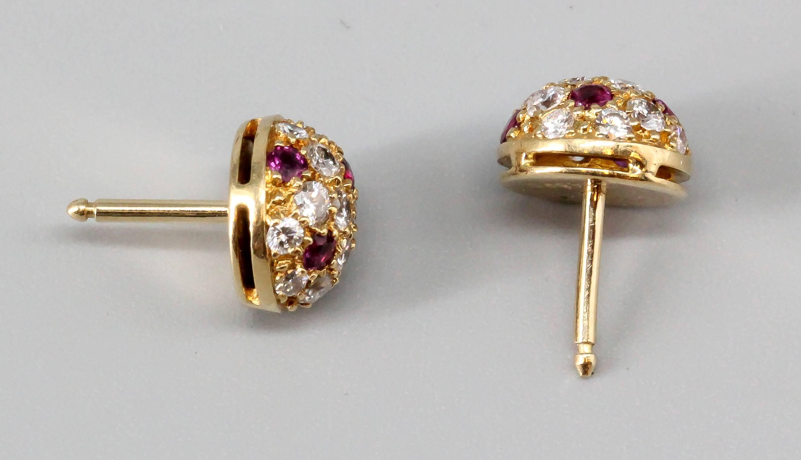 Elegant ruby, diamond and 18K yellow gold stud earrings by Cartier. They feature rich red rubies, along with high grade round brilliant cut diamonds on an 18K yellow gold setting. Impeccable workmanship and easy to wear.

Hallmarks: Cartier, 750,