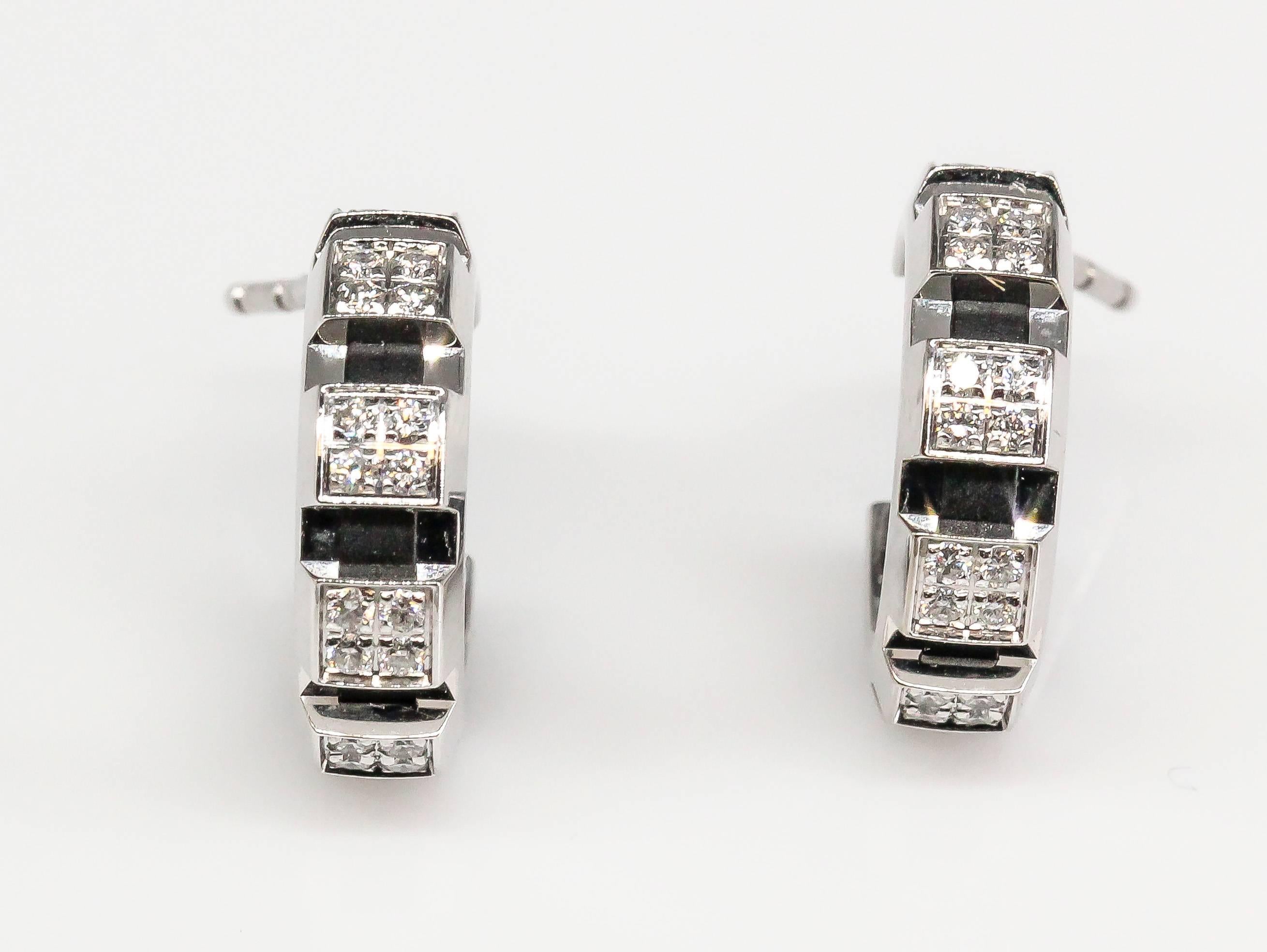 Classic diamond and 18K white gold hoop earrings by Chaumet. This charming set features high grade round brilliant cut diamonds set on an 18K white gold hoop setting. Beautifully made and highly wearable.

Hallmarks: Chaumet, 750, reference numbers.