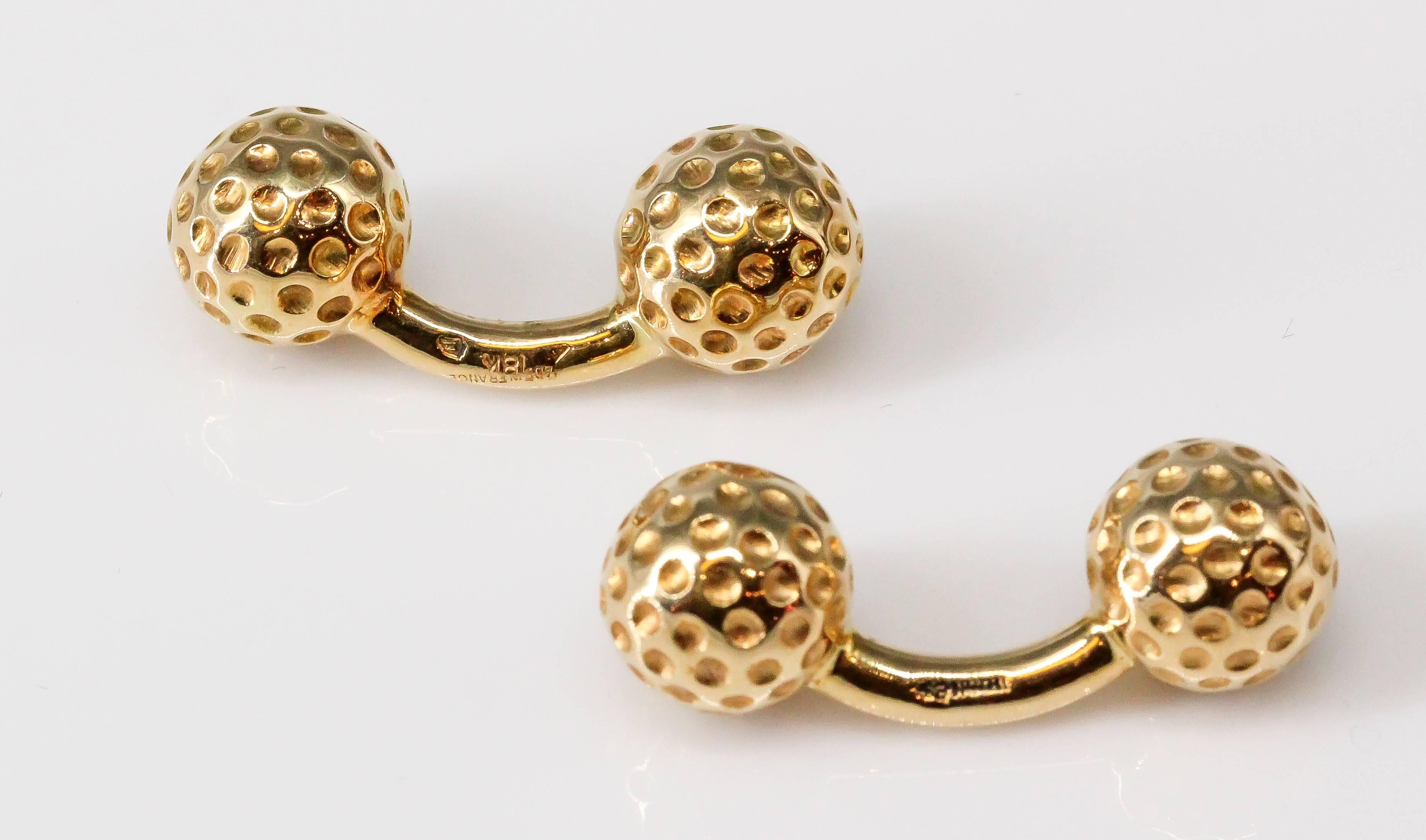 Handsome 18K yellow gold dumbbell cufflinks in the likeness of golf balls, made by Hermes. 

Hallmarks: Hermes, Made in France, 18k, French 18K gold assay mark.