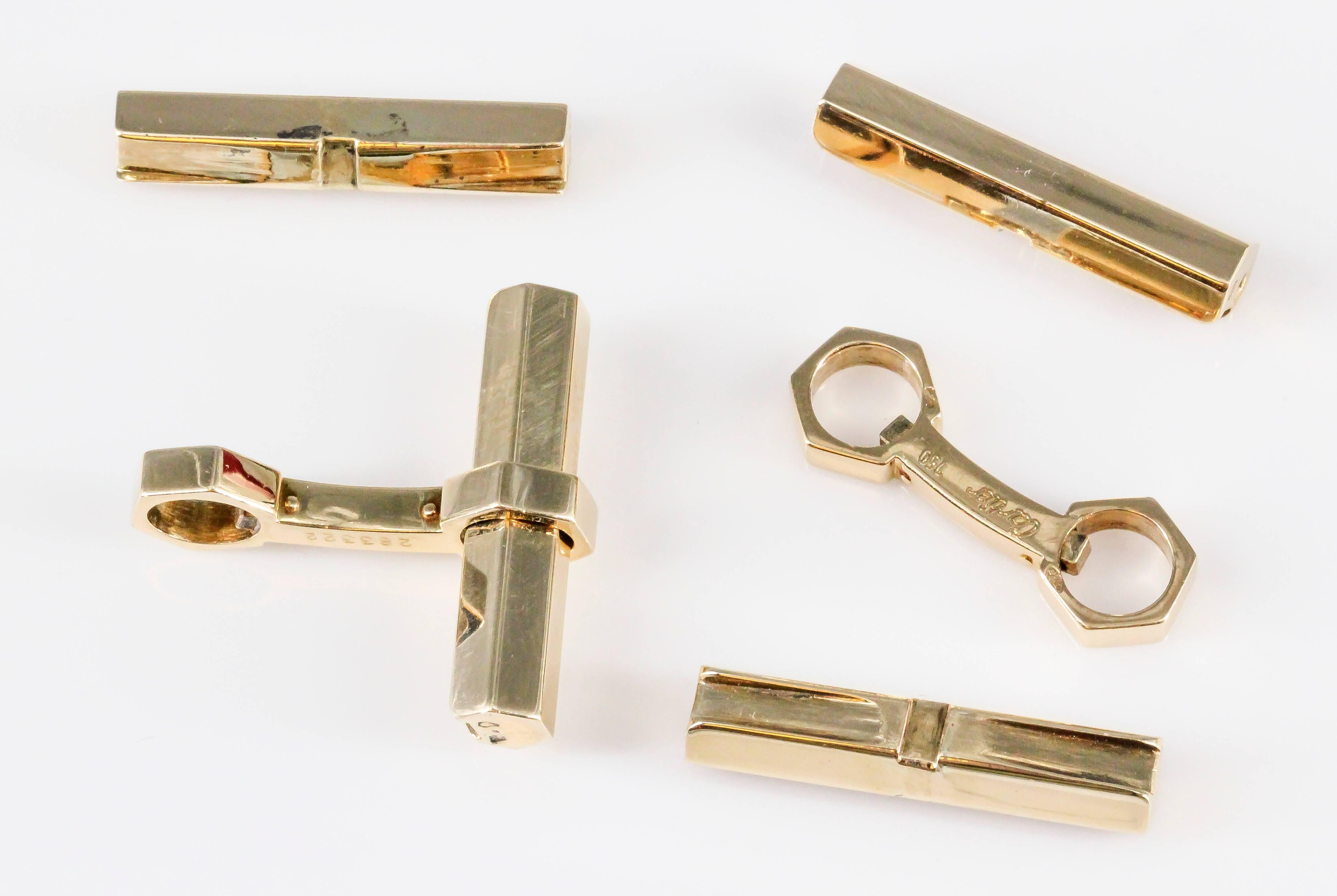 Rare and unusual 18K yellow gold bar cufflinks by Cartier. They feature a hexagonal design bar which makes them much more scarce than the usual round or even square design bar. Bars are removable for easier wear.
Hallmarks: Cartier, reference