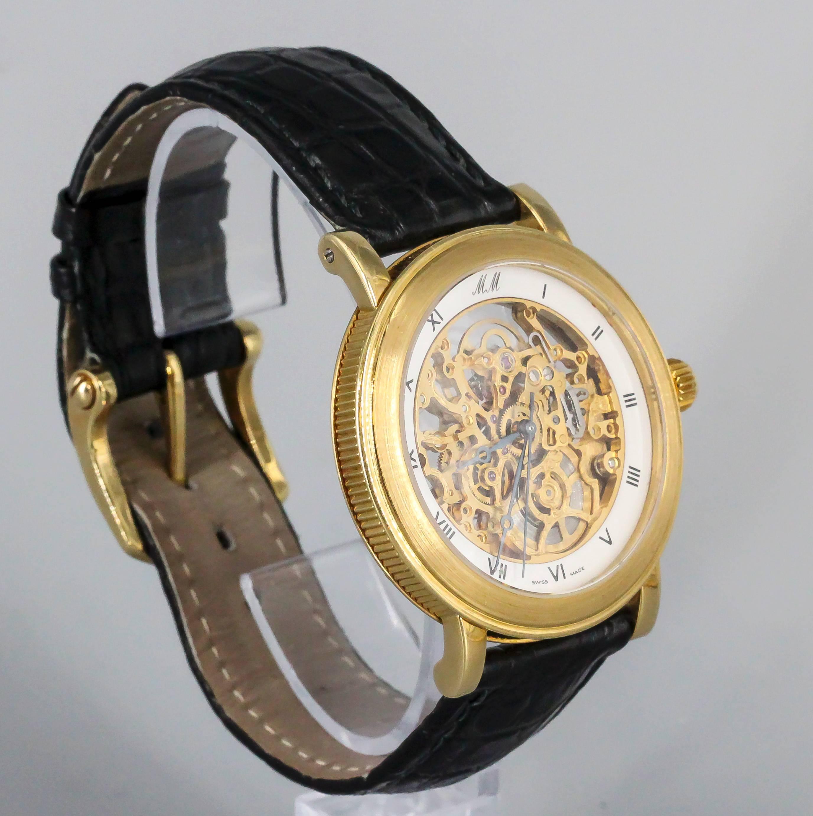 Sehr seltene skelettierte Uhr mit 21 Steinen aus 18 Karat Gelbgold von Marc Magnus. Limitierte Auflage:: nummeriert 