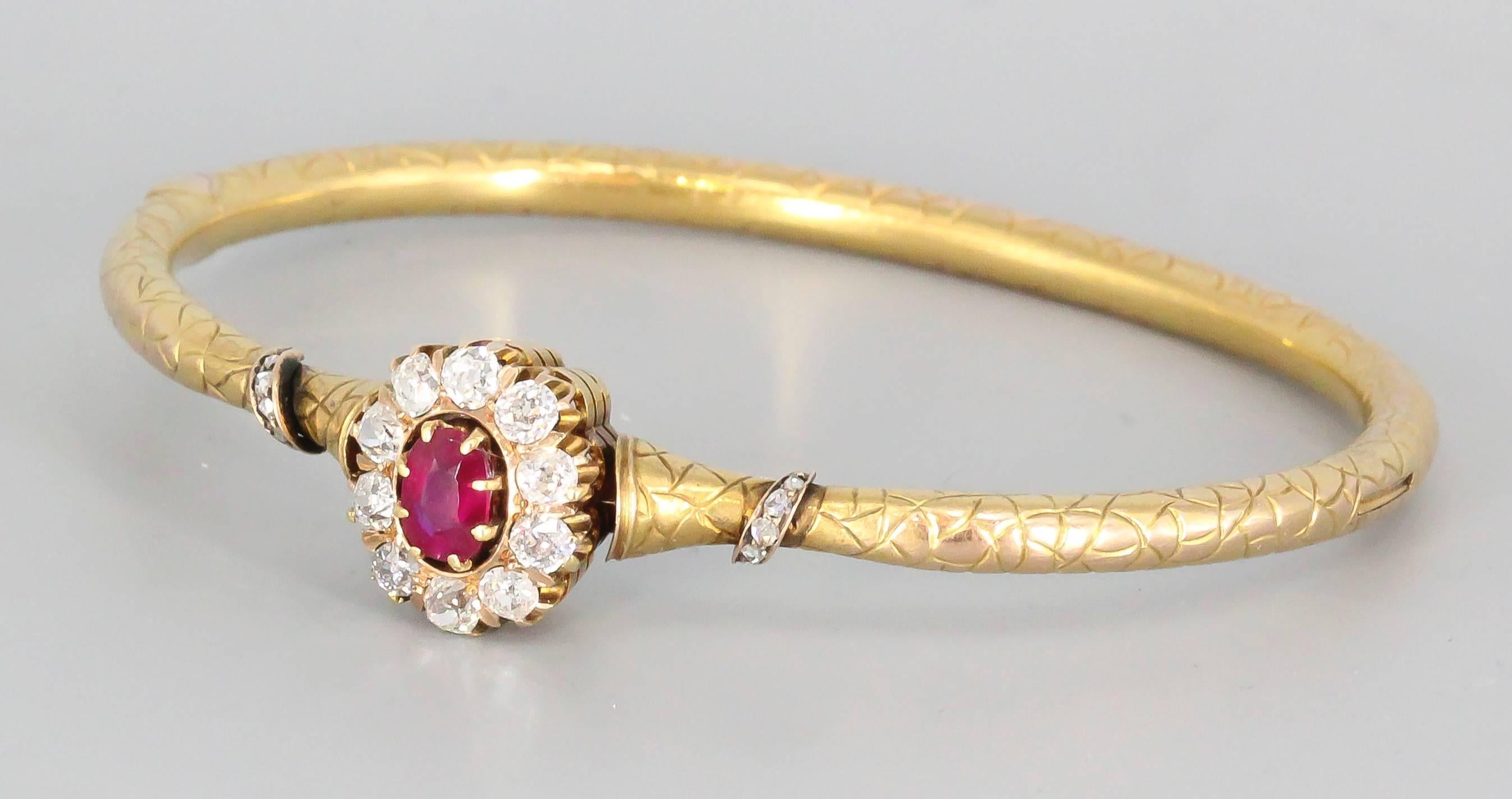 Very rare diamond, ruby and 14K yellow gold antique bangle bracelet by August Wilhem Holmstrom, workmaster for Faberge, circa 1890s. This slender bracelet has one high quality oval ruby, approx. .65cts, framed by 10 old-mine cut diamonds, approx.