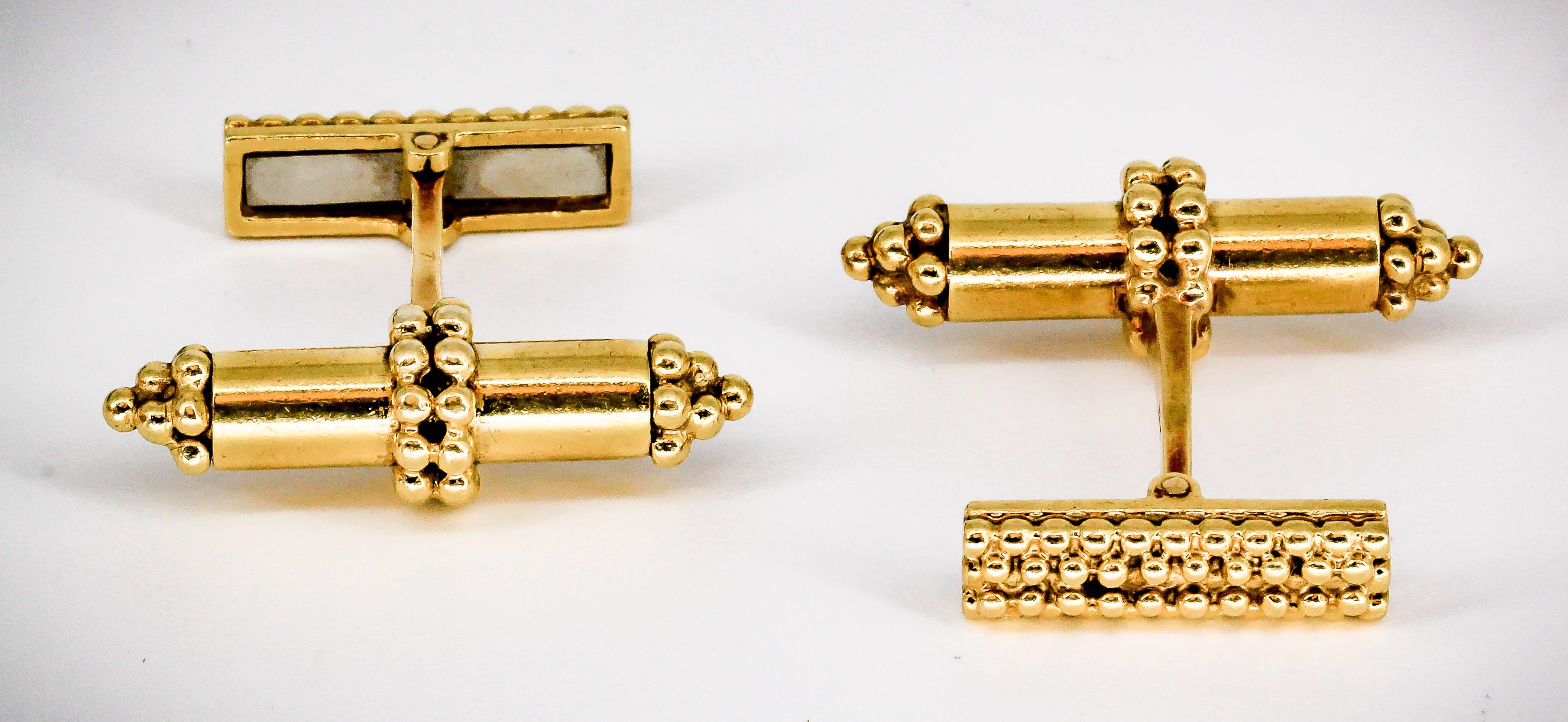 Handsome 18K yellow gold bar cufflinks by Tiffany & Co., circa 1970s, featuring gold bead accents. 

Hallmarks: Tiffany, 18k.