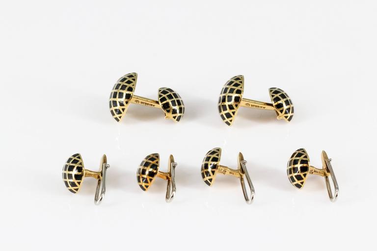 Handsome black enamel and 18K yellow gold cufflink stud set by David Webb. They feature a square button design, with black enamel accents over yellow gold setting. Set comes with four studs. 

Hallmarks: Webb, 18k.