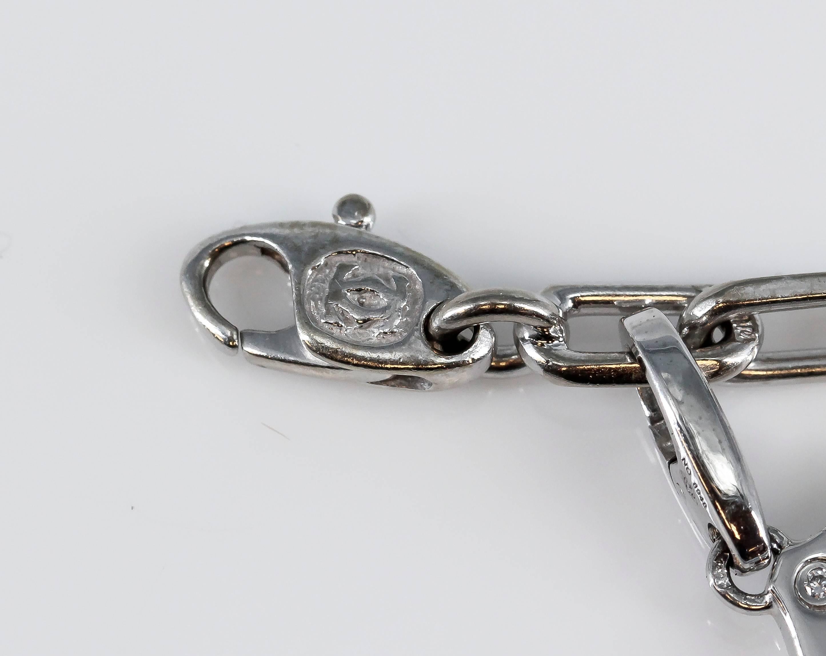 Cartier Diamond White Gold 9 Charm Bracelet In Excellent Condition In New York, NY