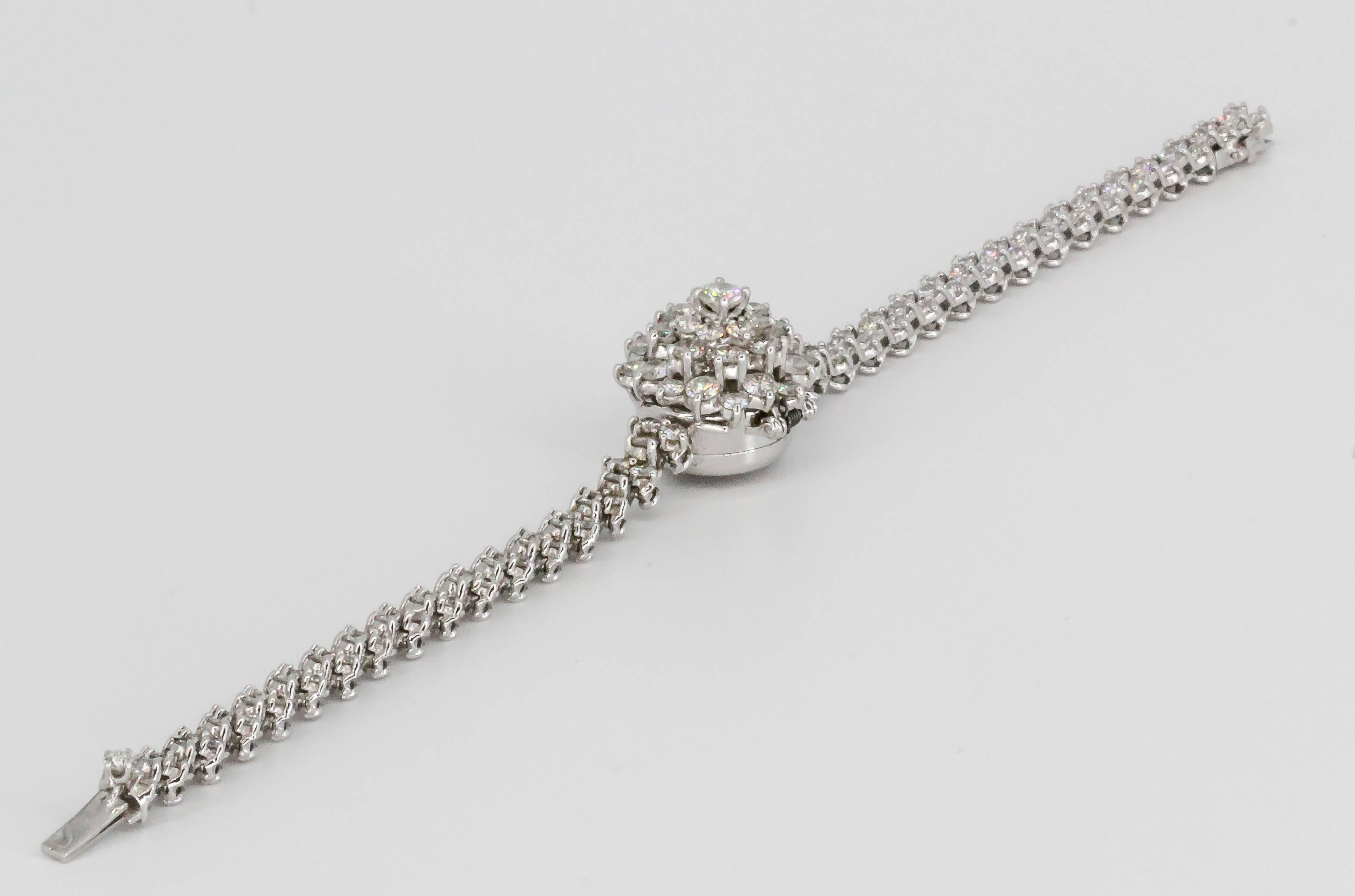 Timeless retro diamond and 18K white gold hidden watch bracelet by Blancpain, circa 1940s. It features high grade round brilliant cut diamonds, approx 4.0-5.0cts total weight. The hidden watch has a backwind mechanism and is signed Blancpain on
