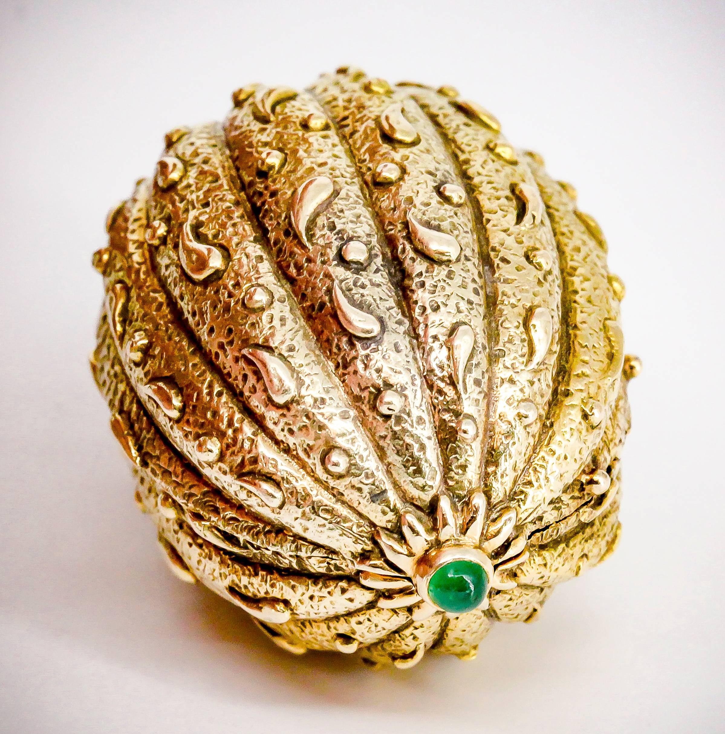 Rare emerald and 18K yellow gold pill box by Tiffany & Co. Schlumberger. It resembles a walnut, with beautifully intricate gold work, a flat base so doesn't roll away, and two rich green cabochon emeralds at each end. Beautifully made and easy