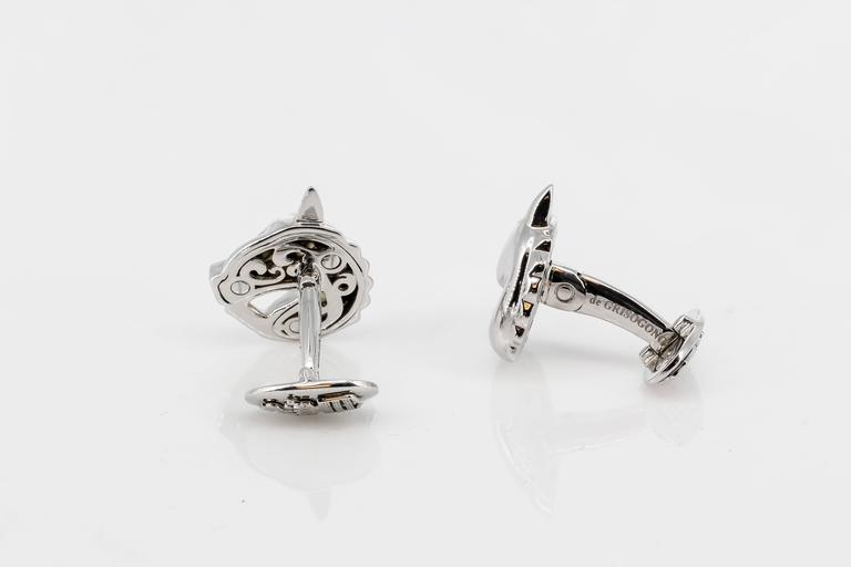Handsome 18K white gold horse head cufflinks by De Grisogono. Lots of detail on the horse design on the front, and royal crown/crest on the bottom end. Expertly made and easy to wear. Original retail price $6600.

Hallmarks: De Grisogono, 750,
