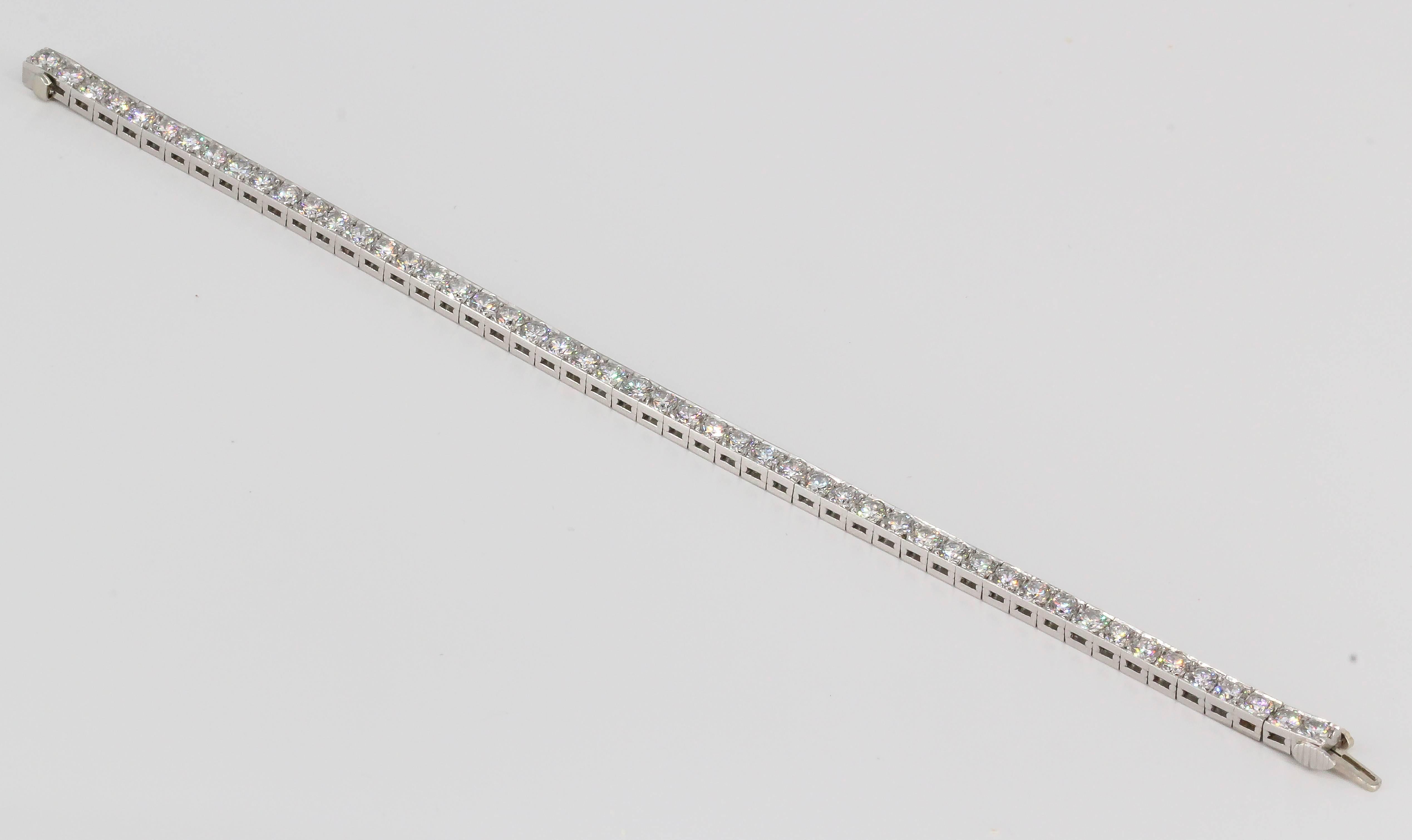 Superb diamond and platinum line bracelet by J. E. Caldwell, circa 1920s-30s. Features high grade round brilliant cut diamonds, approx. 7-8 cts total weight. Exceptional make and quality featuring very little metal, yet a simple understated
