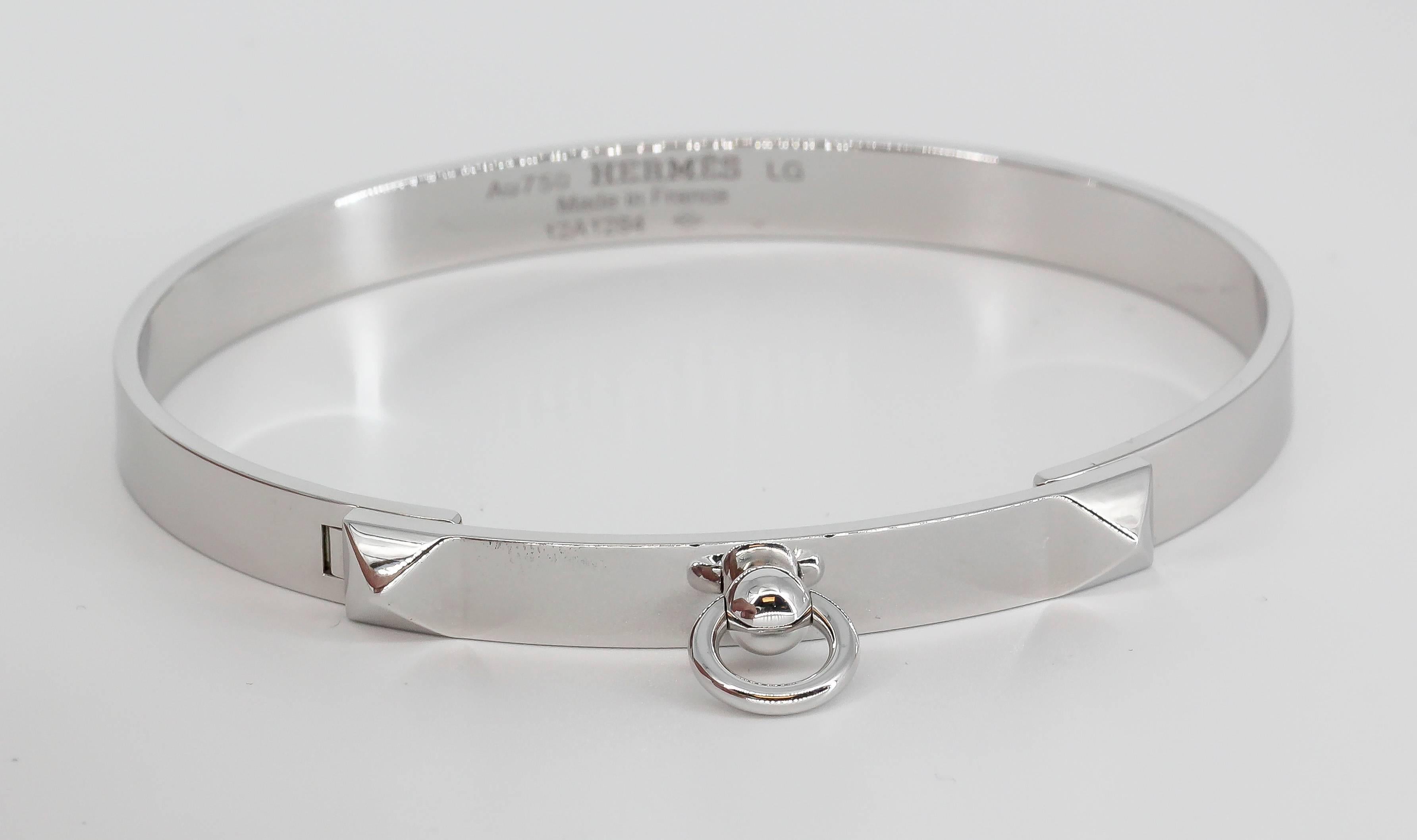Cool 18K White Gold bangle bracelet from the "Collier de Chien" collection by Hermes. Large size.  Current retail $7500.

Hallmarks: Hermes, AU750, reference numbers, French 18K gold assay mark, maker's mark.
