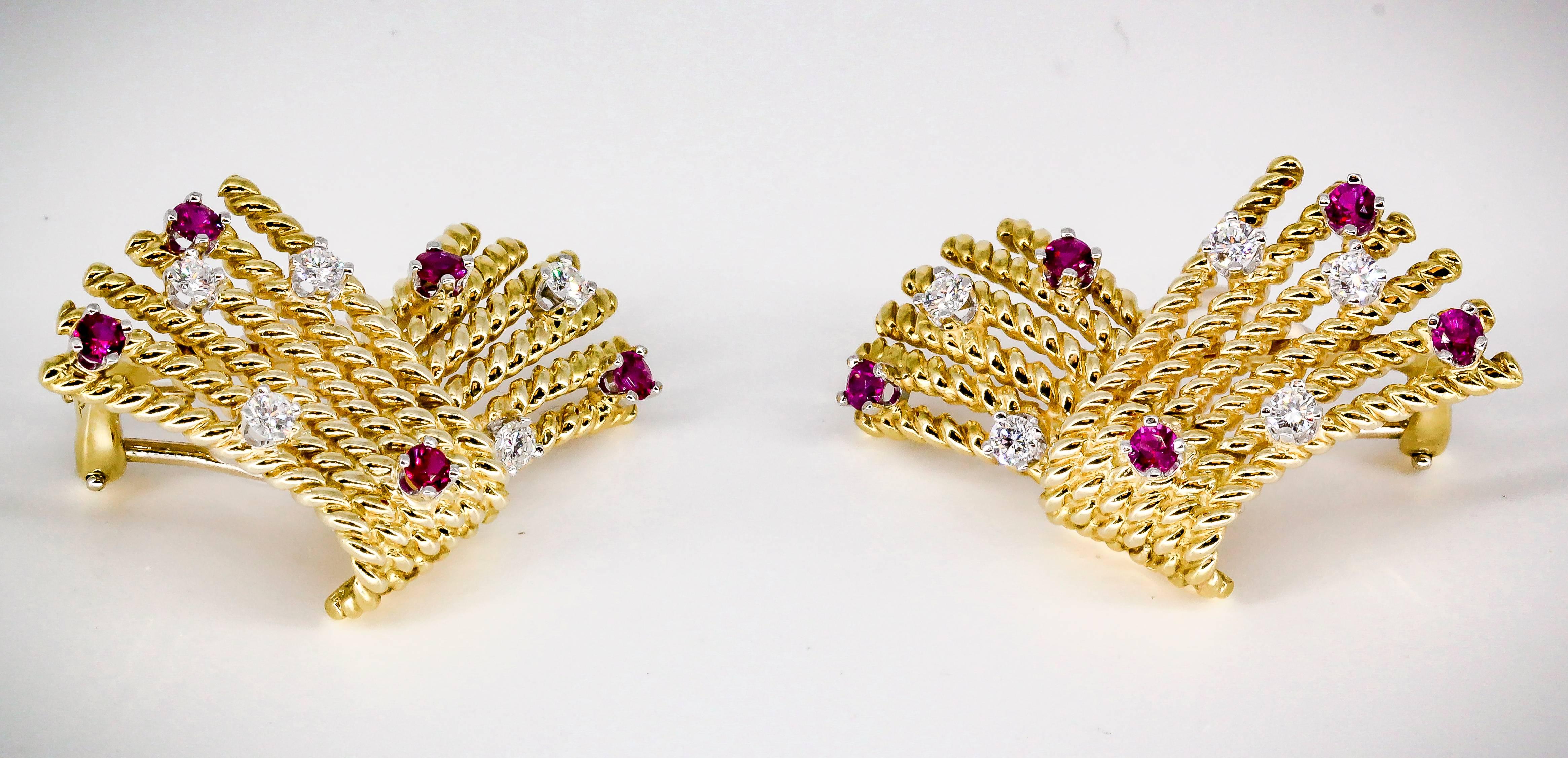 Classic ruby, diamond and 18K yellow gold earrings from the "V Rope" collection by Tiffany & Co. Schlumberger. They feature high grade round brilliant cut diamonds and rich red rubies.

Hallmarks: Tiffany & Co., Schlumberger, 750
