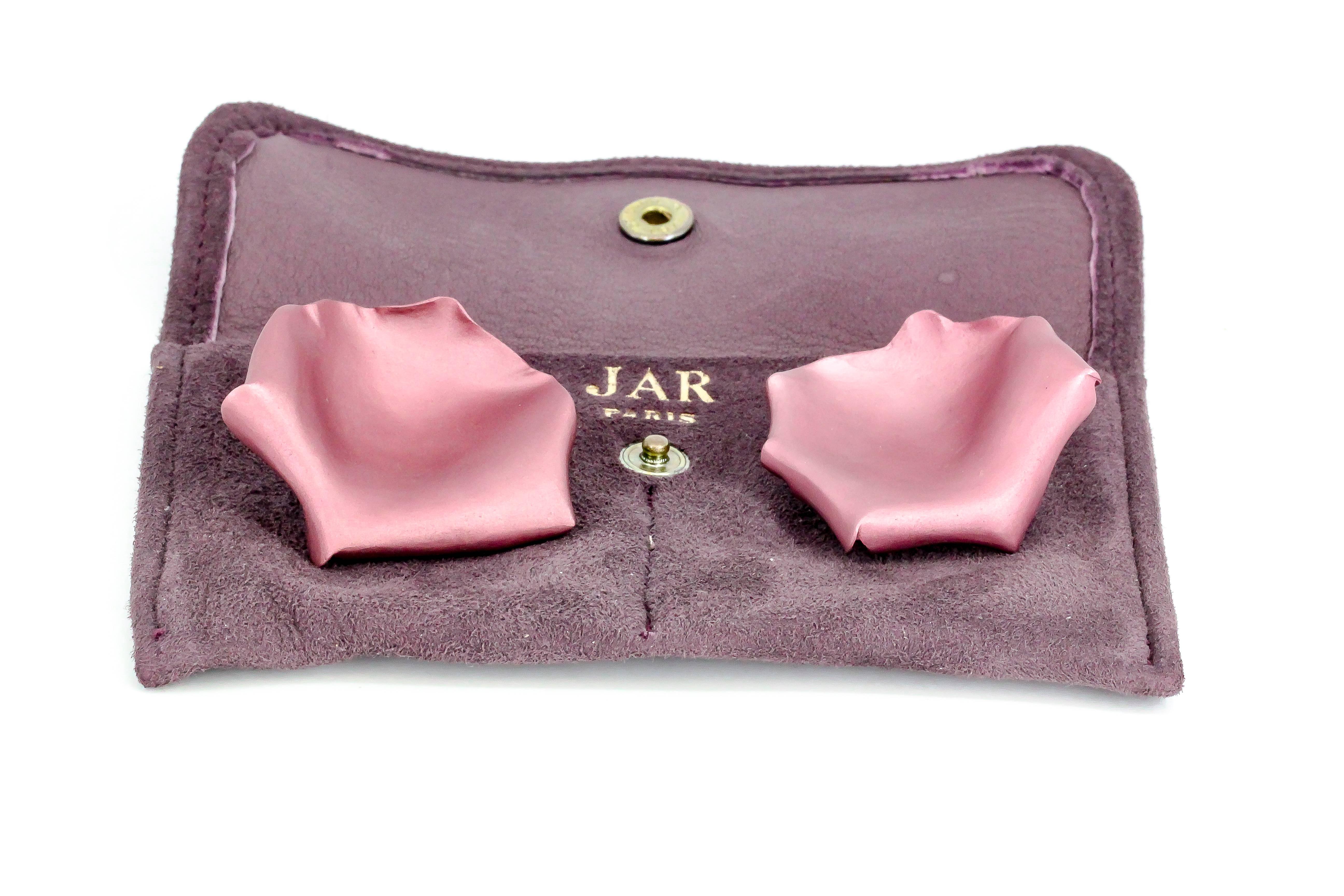 Rare and unusual brushed aluminum and 18K yellow gold clip-on earrings by JAR, Joel Arthur Rosenthal. They feature a purple matte finish and resemble rose petals, hence the name. 

Hallmarks: JAR, Paris, French 18k gold assay mark and maker's mark.