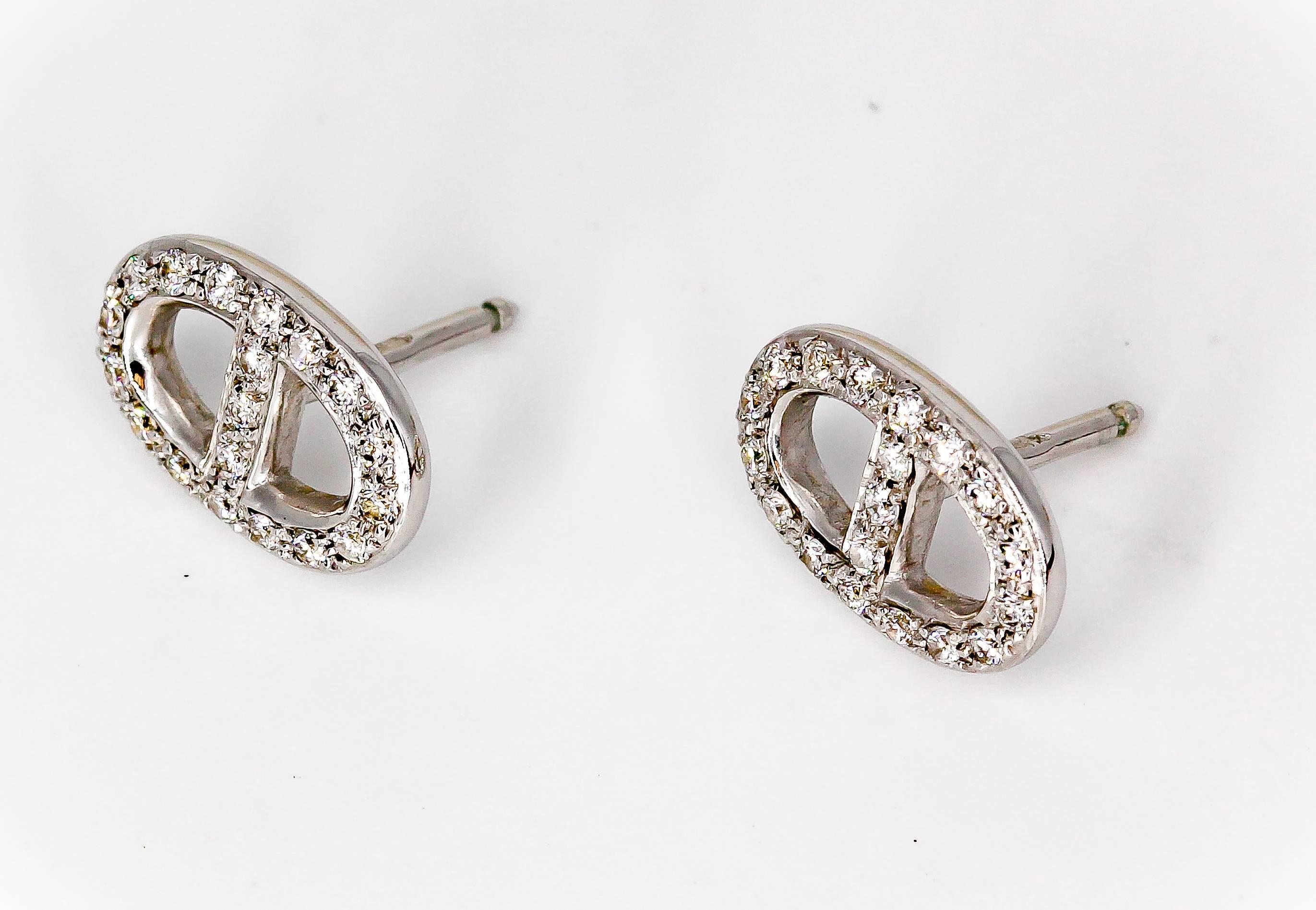 Elegant diamond and 18K white gold earrings from the "Chaine D'Ancre" collection by Hermes. They feature high grade round brilliant cut diamonds throughout.

Hallmarks: Hermes, Au750, reference numbers, French gold assay mark, maker's mark.