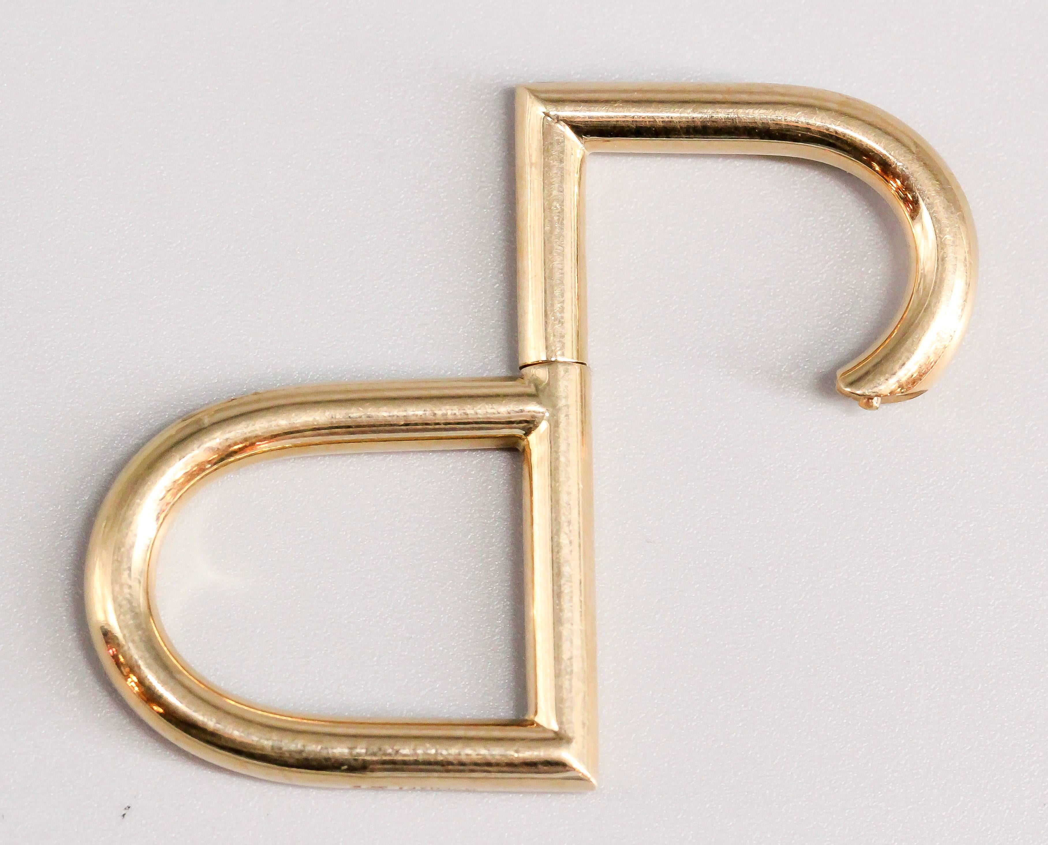 Whimsical 18K yellow gold keychain by Bulgari. It resembles the letter 