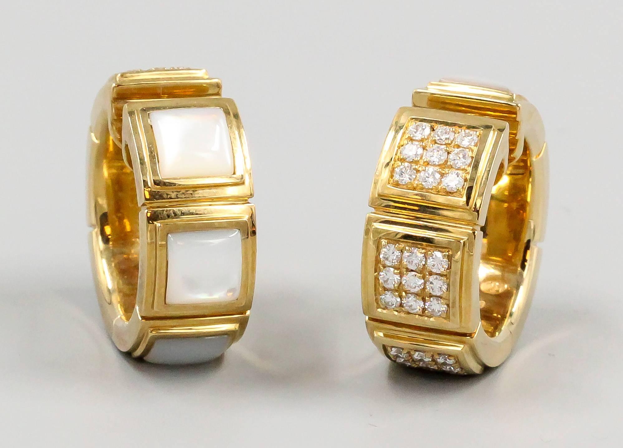 Stylish diamond, mother of pearl and 18K yellow gold earrings by Mauboussin Paris. They feature very high grade round brilliant cut diamonds, approx. total weight; as well as mother of pearl. These are interesting because they can be worn with