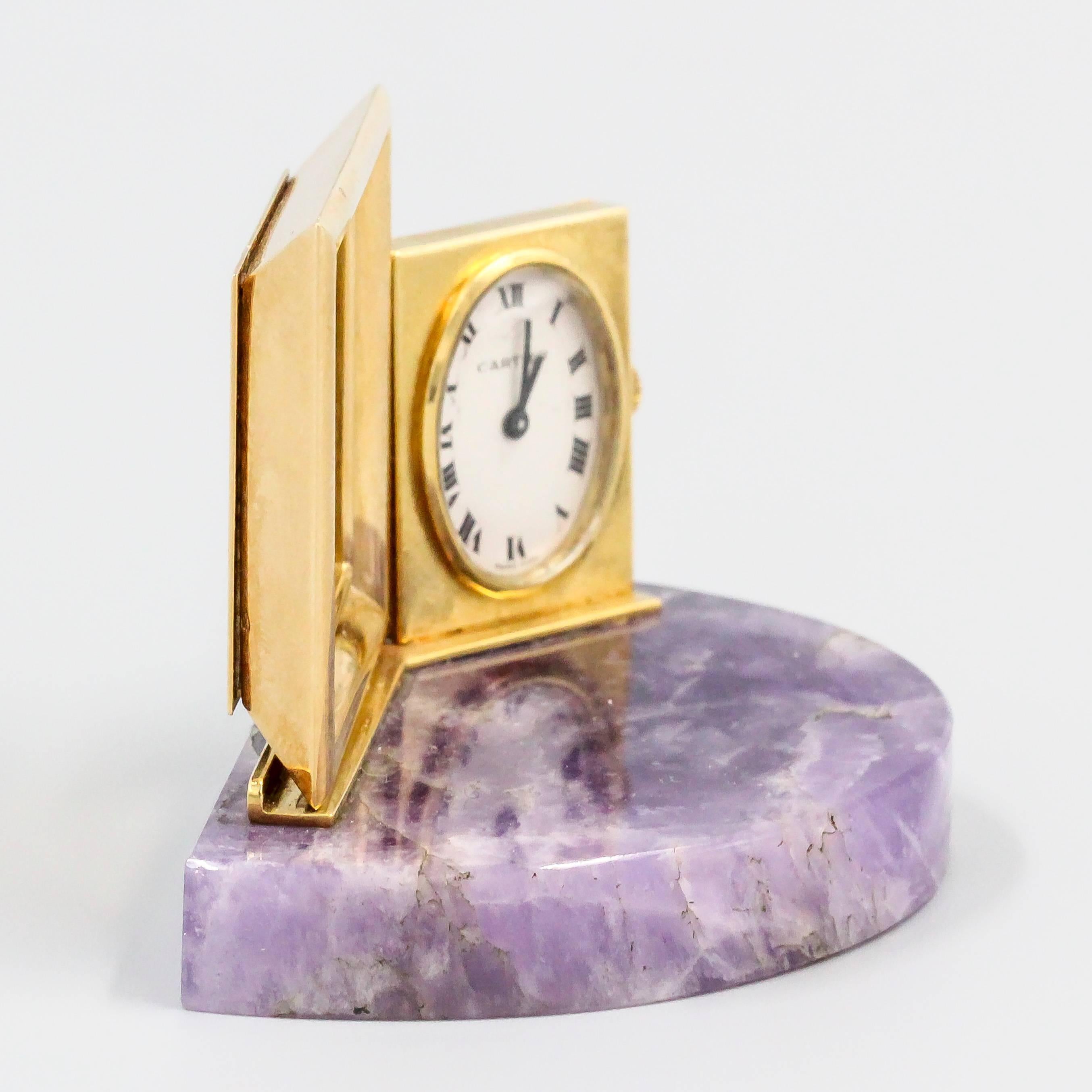 Rare and unusual 18K yellow gold and amethyst clock with attached picture frame by Cartier, circa 1960s. It features an amethyst base, with picture frame able to hold a 1