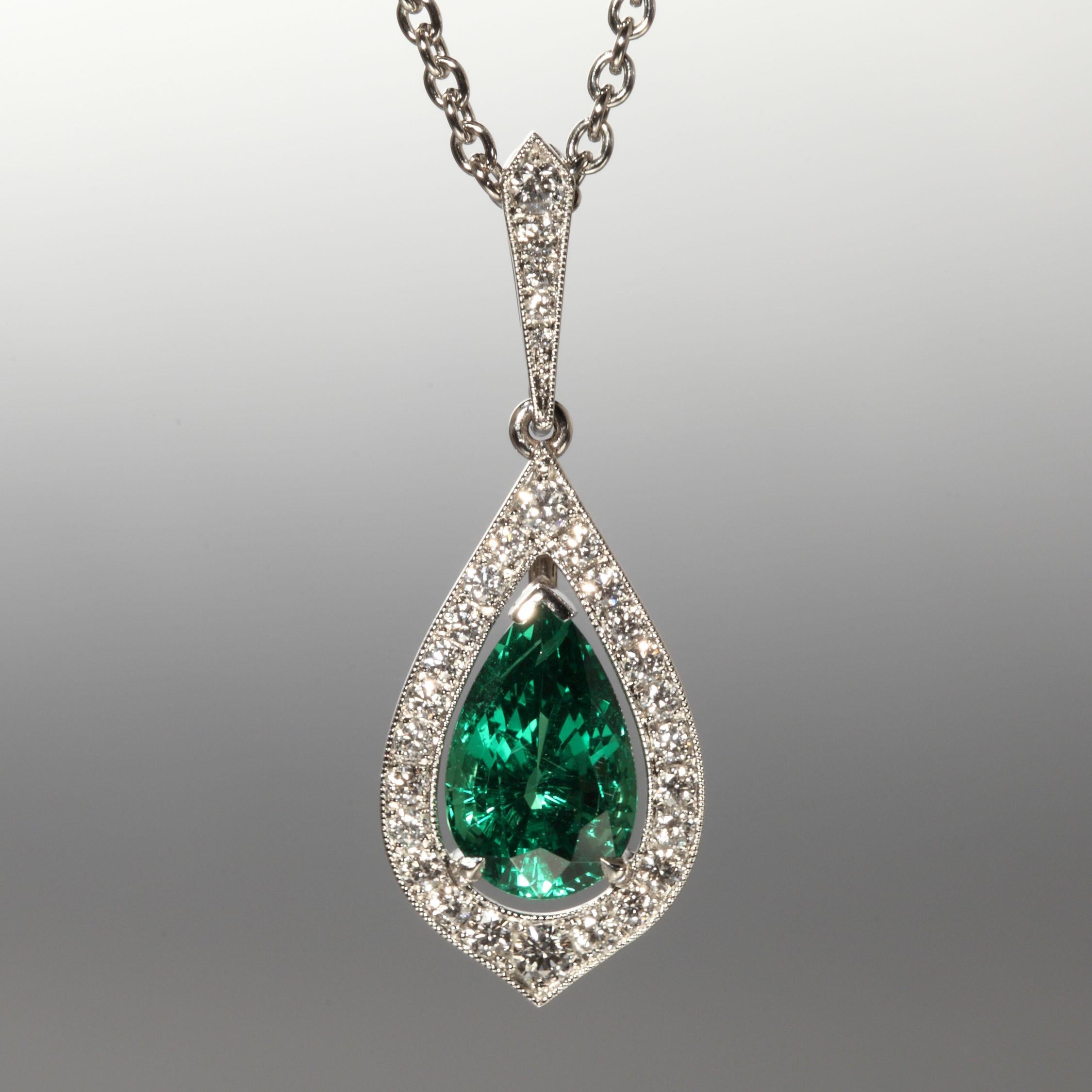 This platinum pendant is set with a fine green tsavorite drop 2.23 carat and 0.30 carats Diamonds F,G vvs on an attached platinum chain. It is designed and hand made in Zurich, Switzerland by Robert Vogelsang and is a one of a kind piece signed