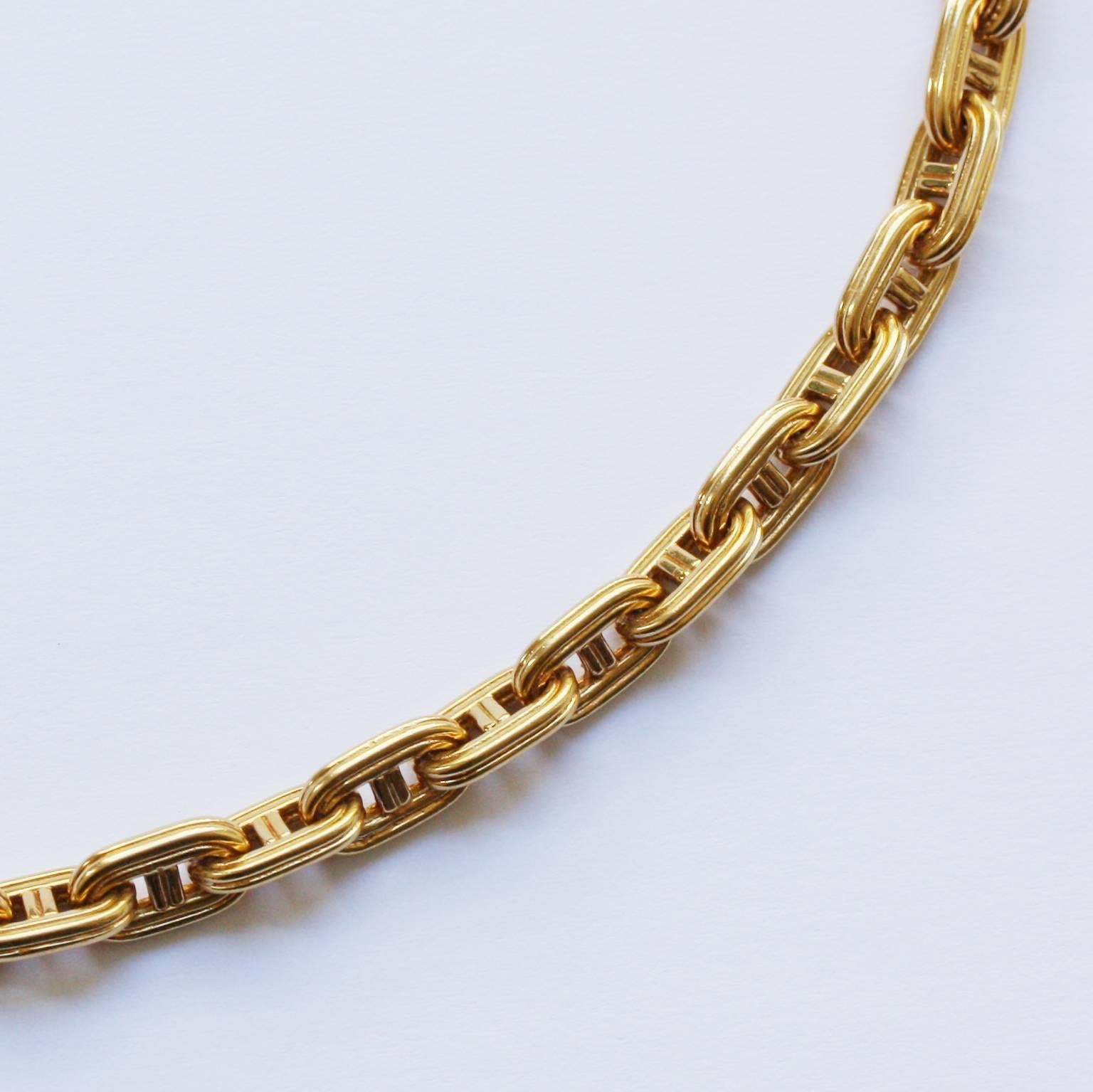 An 18 carat gold necklace by Georges Lenfant for Hermès signed and numbered: Hermès, 11290, model: Chaîne d’ancre, deux fils, circa 1970.

weight: 56.8 gram
length: 40 cm.