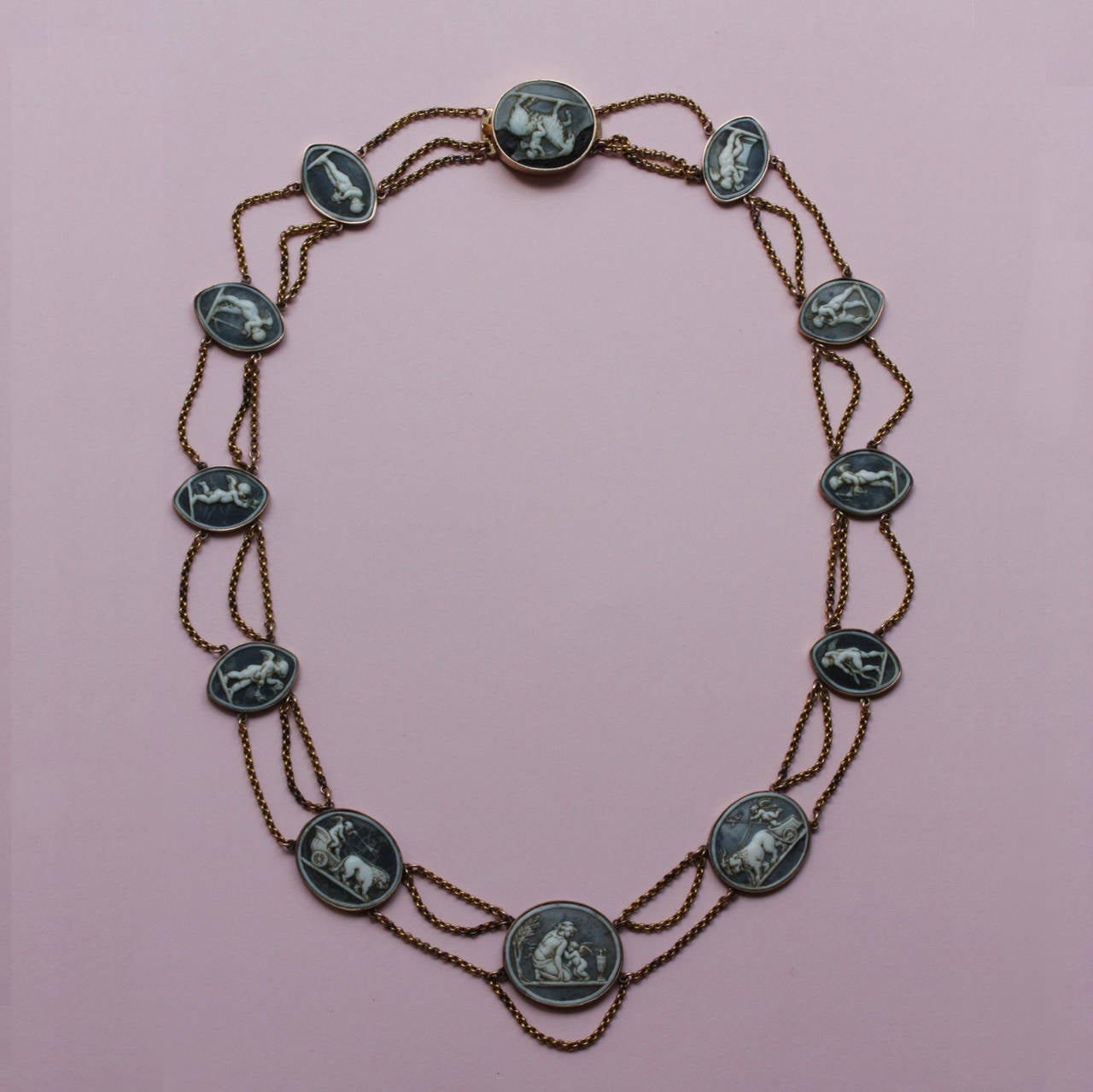 This delightful necklace is an elegant evocation of Classical antiquity. It may well have begun life as an intimate and treasured reminder of the Grand Tour. The cameos would have been bought in Italy; then set into a necklace back home in England.