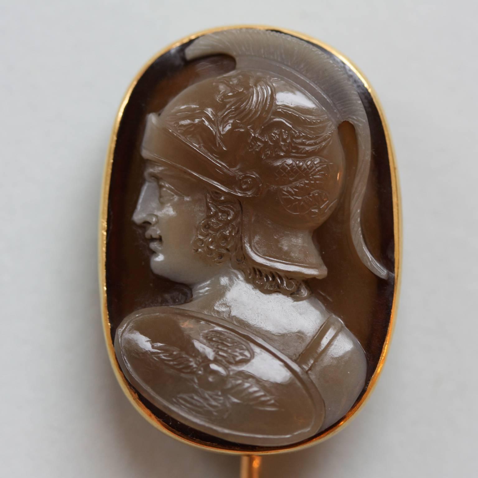 An 18 carat gold (stick)pin with an agate cameo representing Mars or Ares, god of war, son of Hera and Zeus, lover of Aphrodite, master mark: IM with a lyre in between, the cameo is numbered 91, France, 19th century.

weight: 7 gram
length pin: