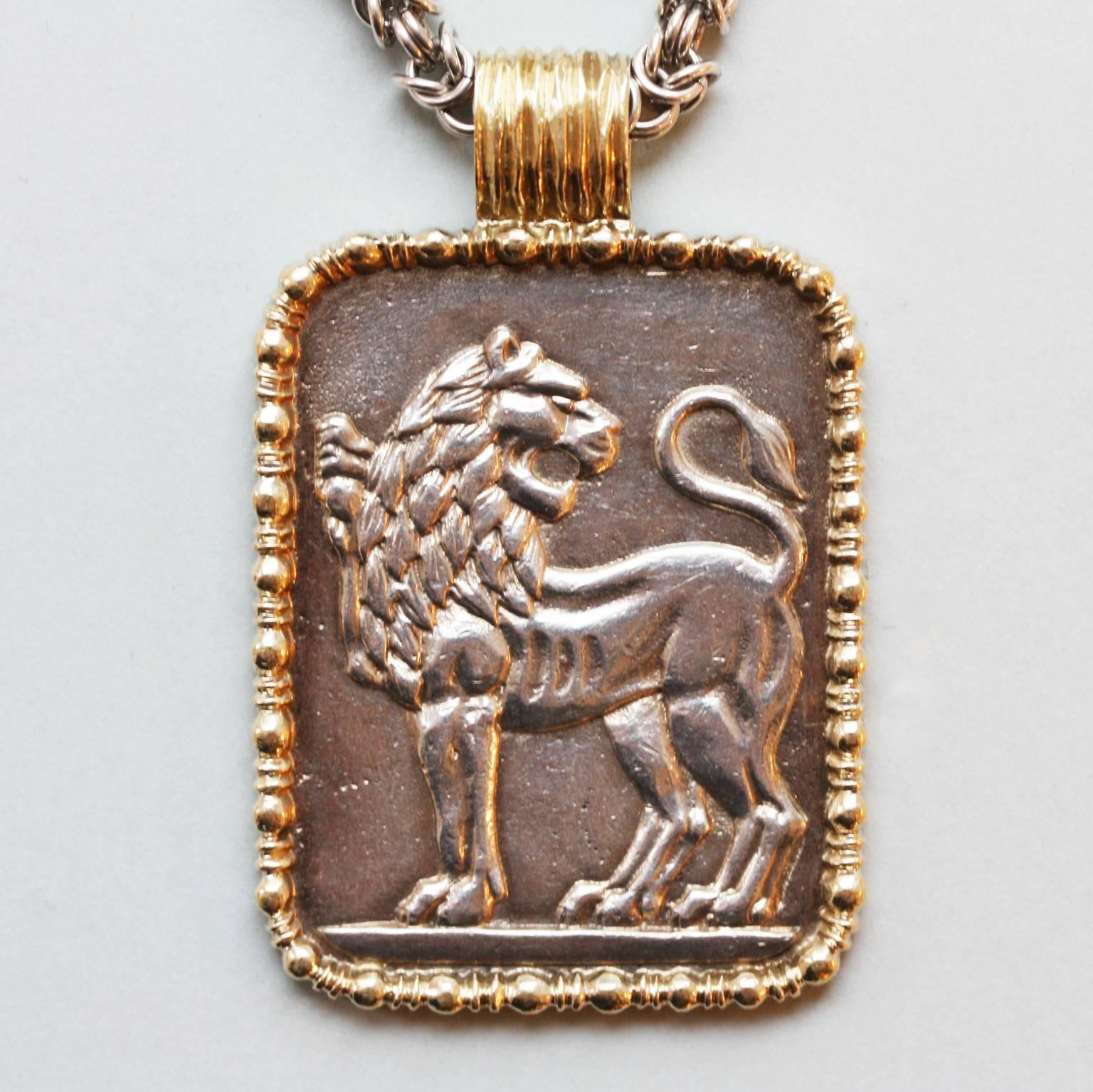 A silver and silver gilt chain (Byzantine and cable link) with a silver gilt Leo zodiac, signed: Fred, Paris, circa 1970/80.

total weight: 108 grams
length chain 95 cm.
dimensions zodiac: 5.2 x 3.3. cm.