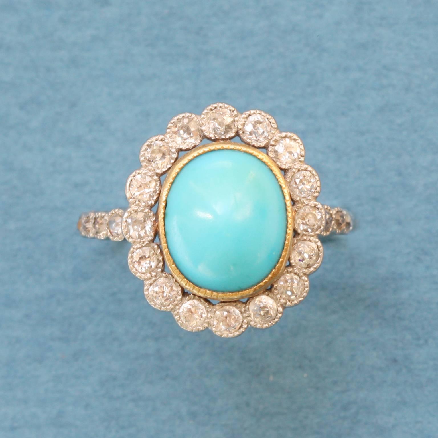 A platinum and gold edwardian cluster ring with small old cut diamonds around a cabochon cut turquoise, circa 1910.

ring size: 15.5 mm 4 3/4 US.
weight: 4.1 grams