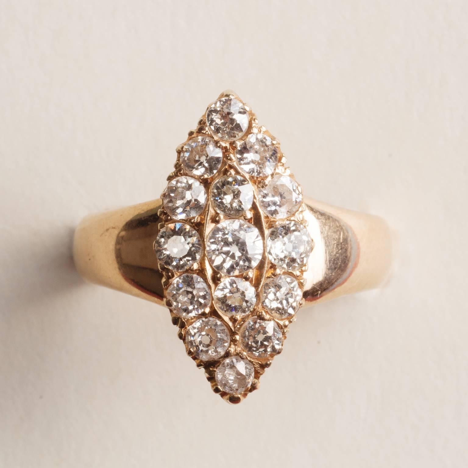 An 18 carat gold marquise shaped ring set with 15 old cut diamonds (app. 0.8 carats), 19th century.

weight: 4.4 gram
ring size: 16.75 mm. 6 1/4 US.
