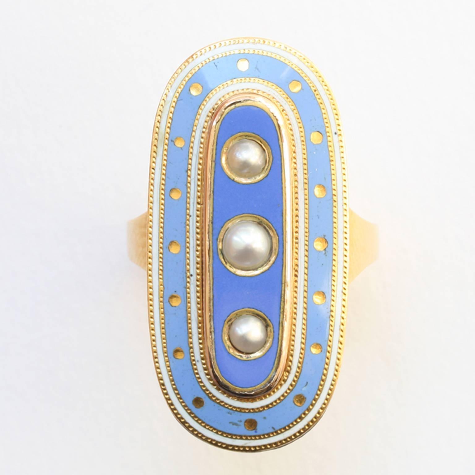 An 18 carat gold oval mourning ring with baby blue and white enamel (the white symbolizing the loss of a child and the blue is because Anne was considered to be royalty in the hearts of her family) decorated with three natural pearls in the center