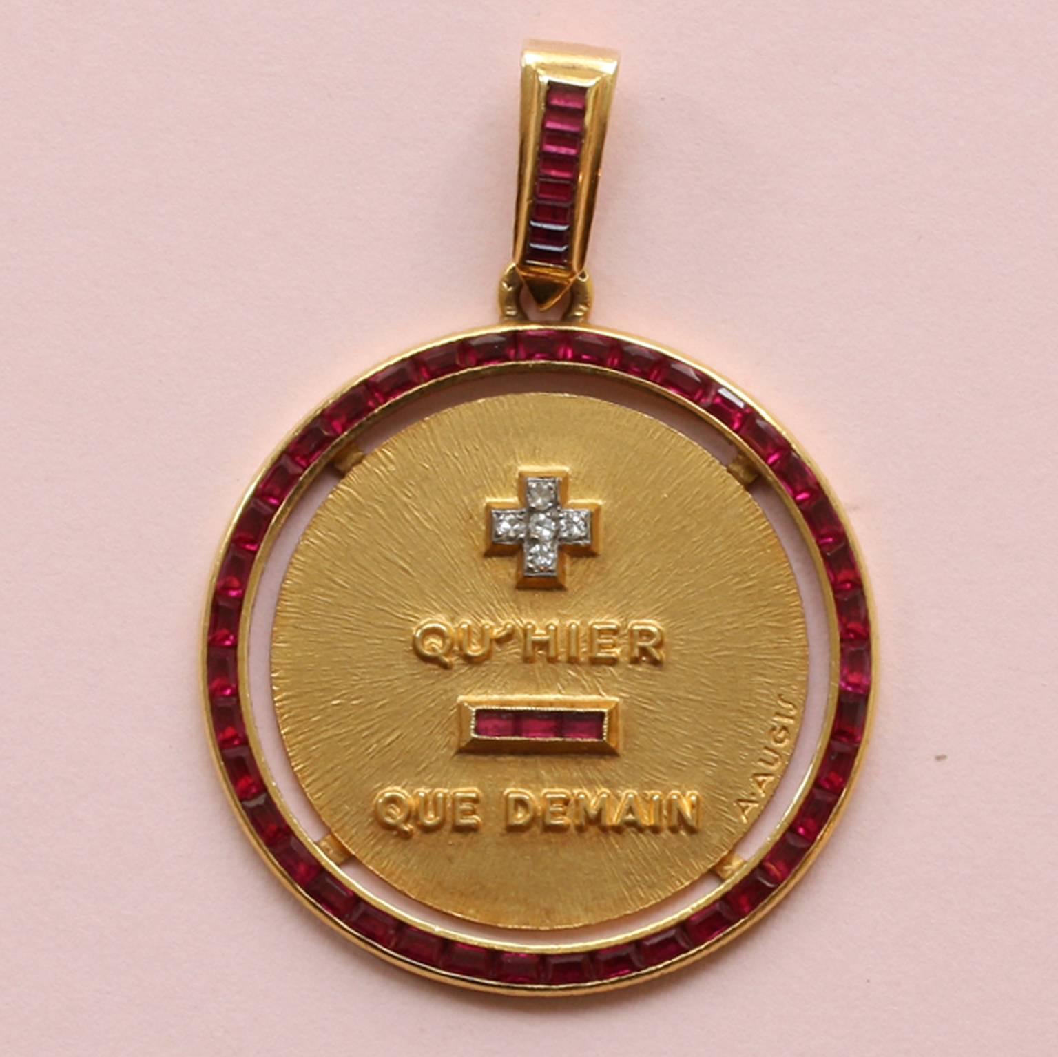 A huge love charm with ruby border, 18 carat gold on chain, 1970.

weight: 13.9 grams.
diameter without hoop: 3 cm cm.

French poet Rosemonde Gérard (1871-1953) wrote this poem for her husband, Edmond Rostand (1868–1918) who was the author of