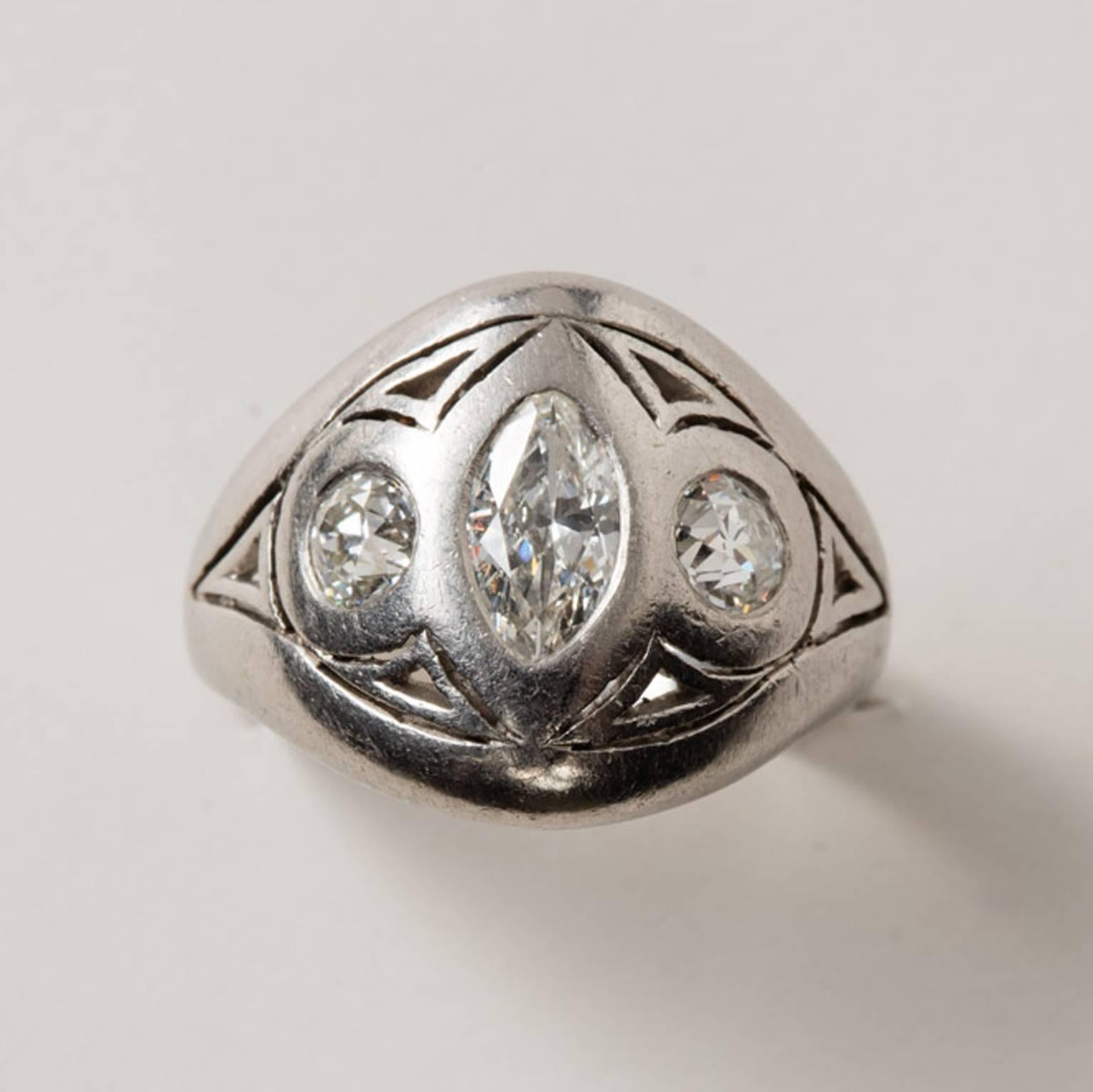 An Art Nouveau platinum and diamond (app. 1.45 carats) ring with triangle open worked decorations, circa 1900, USA.

weight: 9.4 grams
height: 1.6 cm 